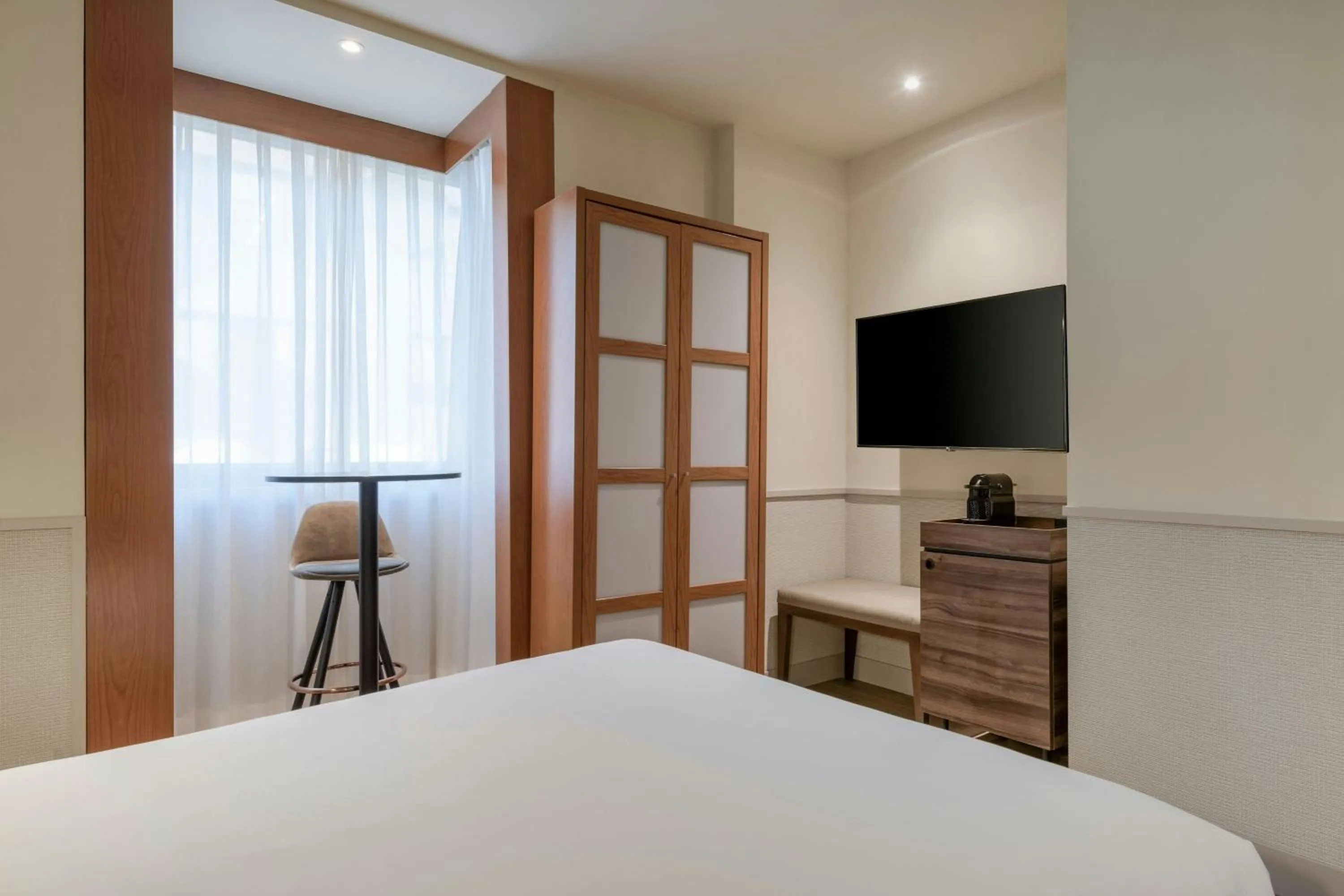 Photo of the whole room, Bed in AC Hotel Los Vascos by Marriott