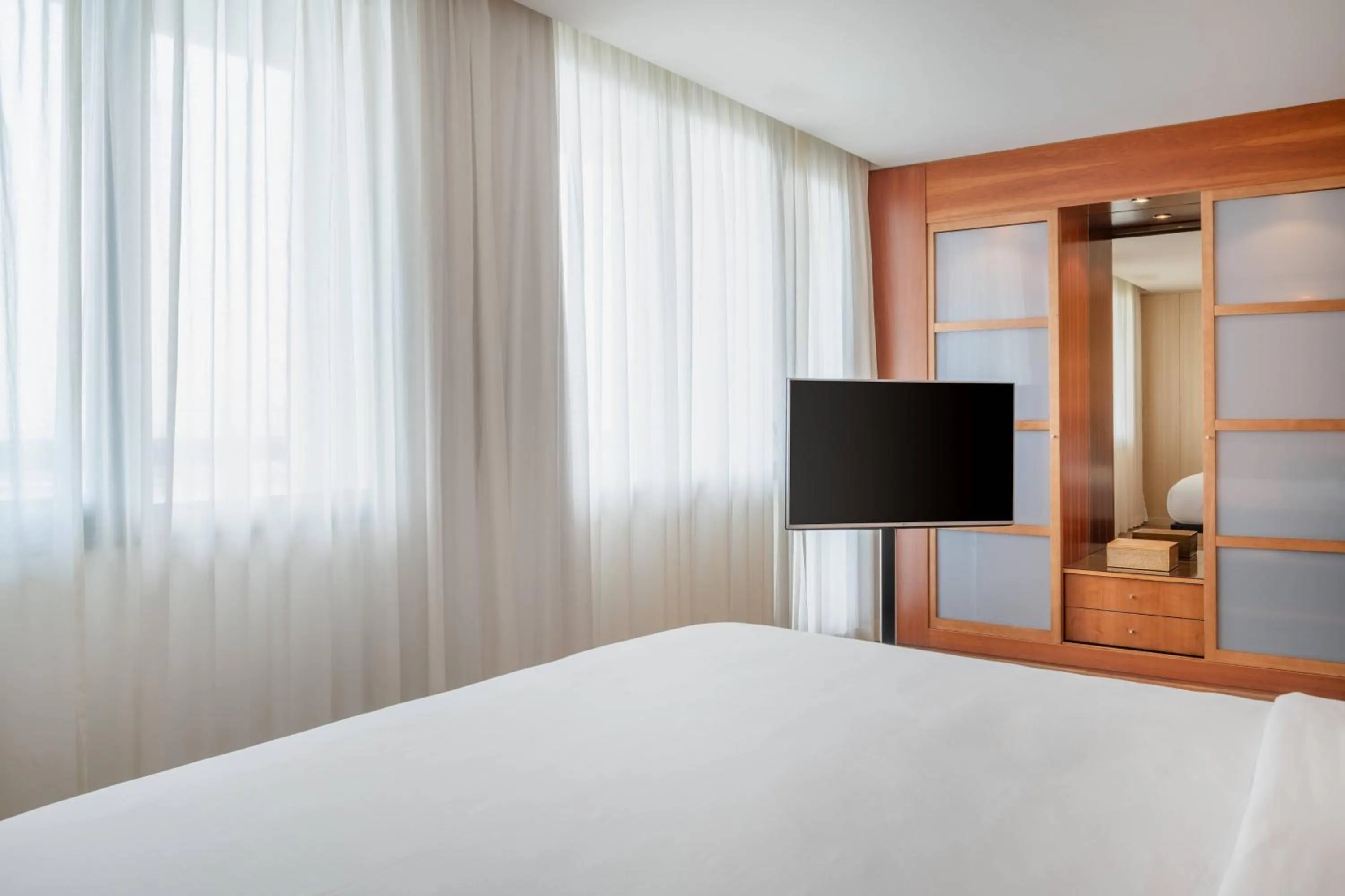 Photo of the whole room, Bed in AC Hotel Málaga Palacio by Marriott