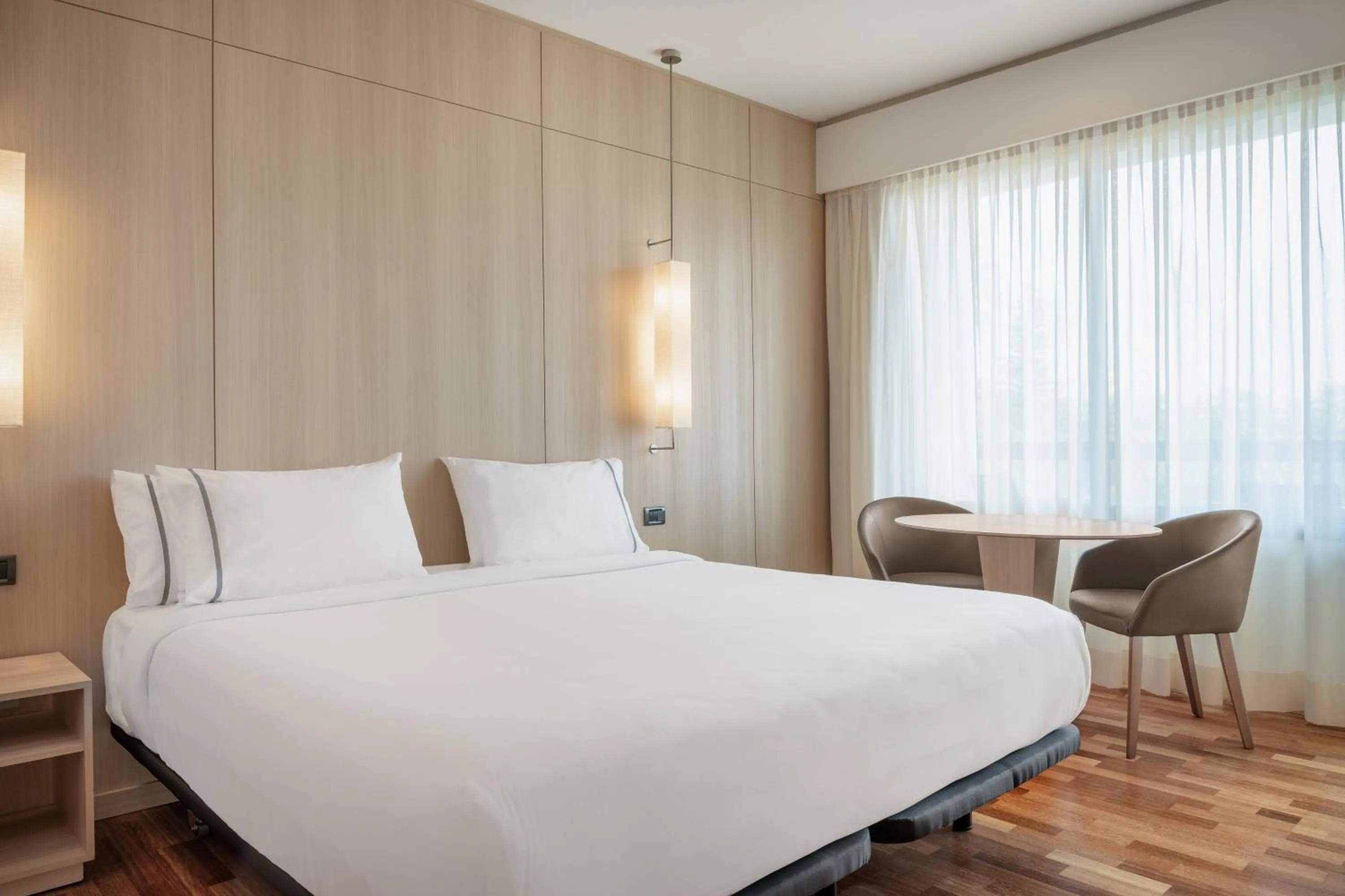 Photo of the whole room, Bed in AC Hotel Málaga Palacio by Marriott