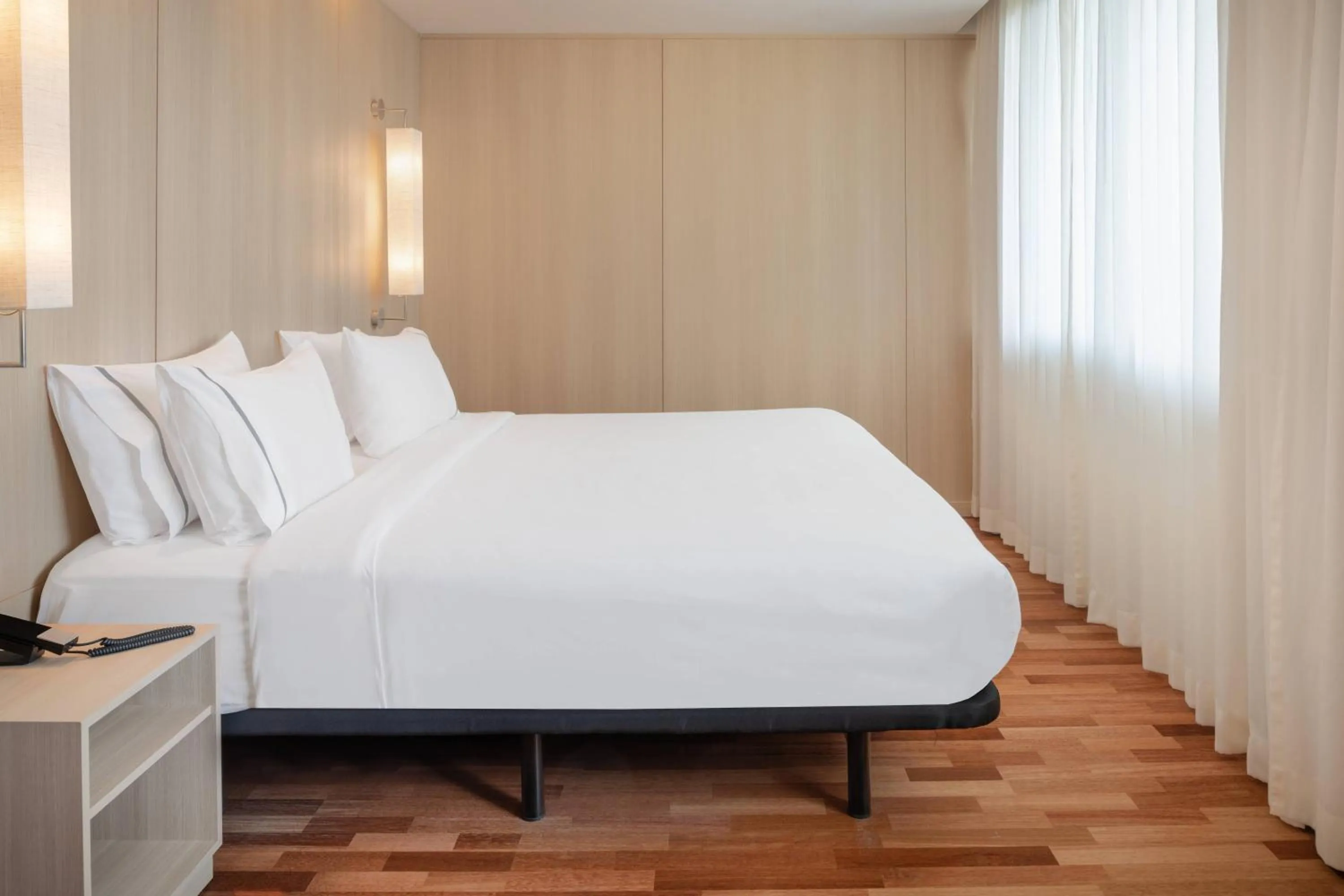 Photo of the whole room, Bed in AC Hotel Málaga Palacio by Marriott