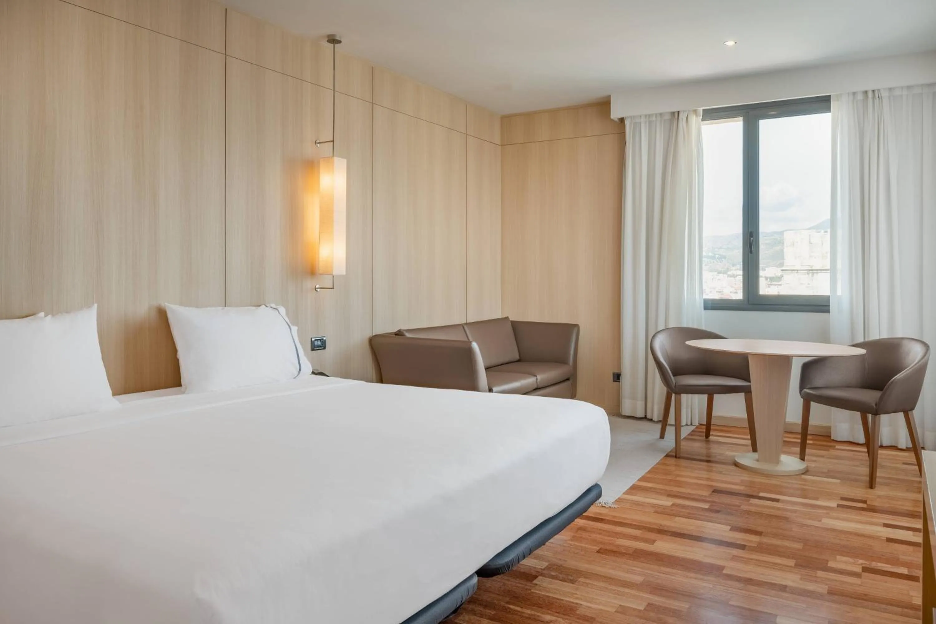 Photo of the whole room, Bed in AC Hotel Málaga Palacio by Marriott