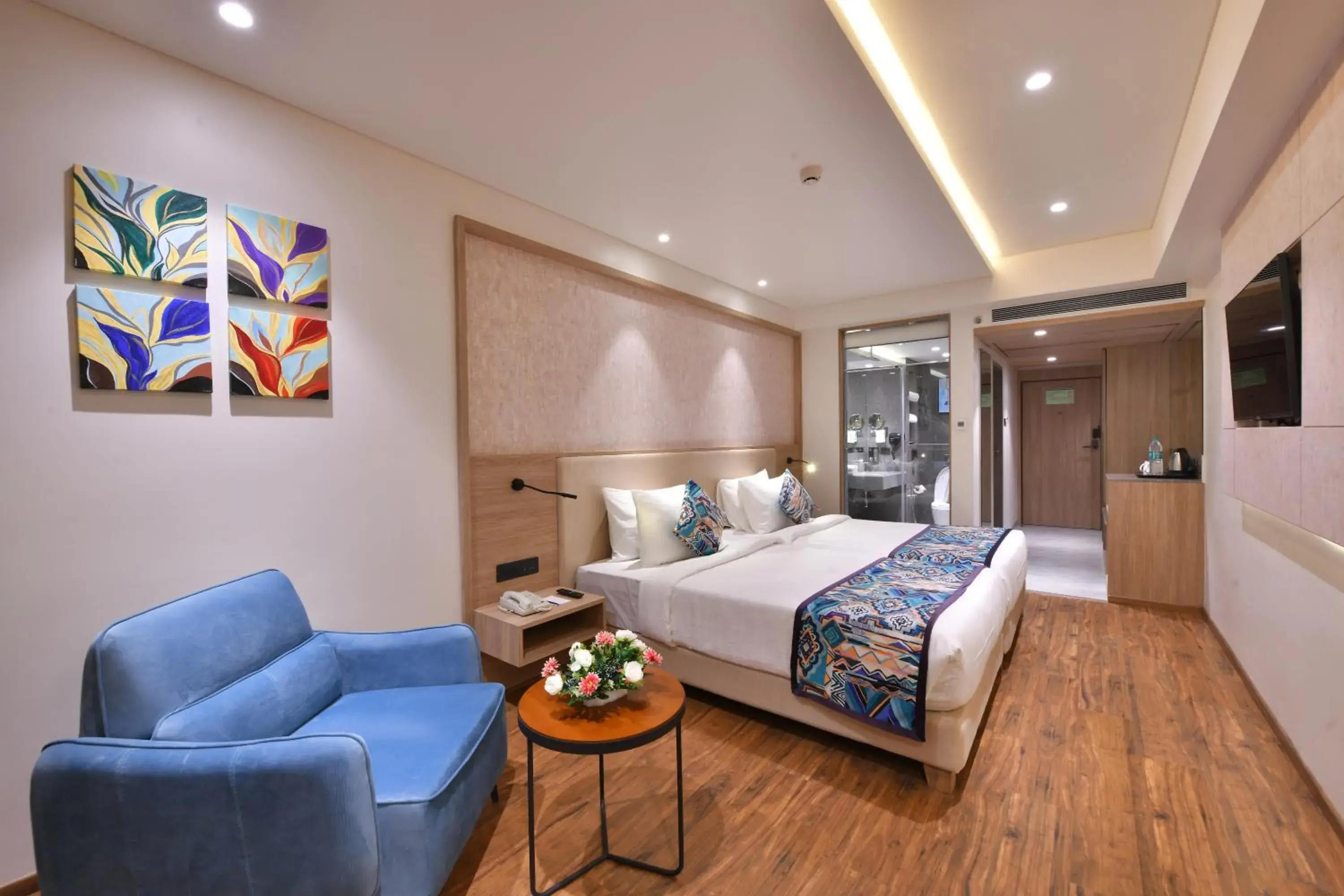 Seating area, Bed in Regenta Fairlark Vadodara Seating area, Bed in Regenta Fairlark Vadodara