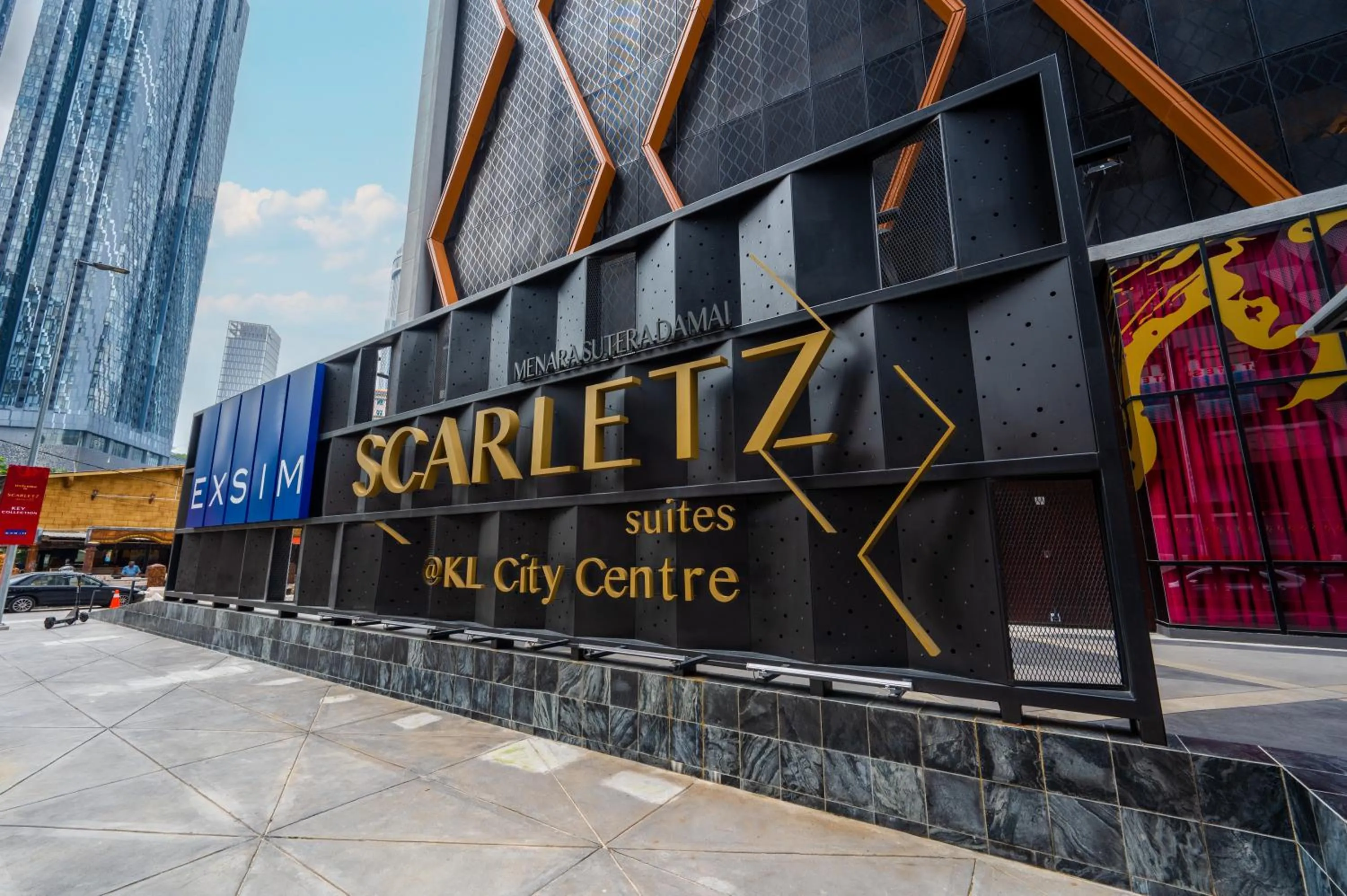 Property logo or sign in Greystone Scarletz Suites