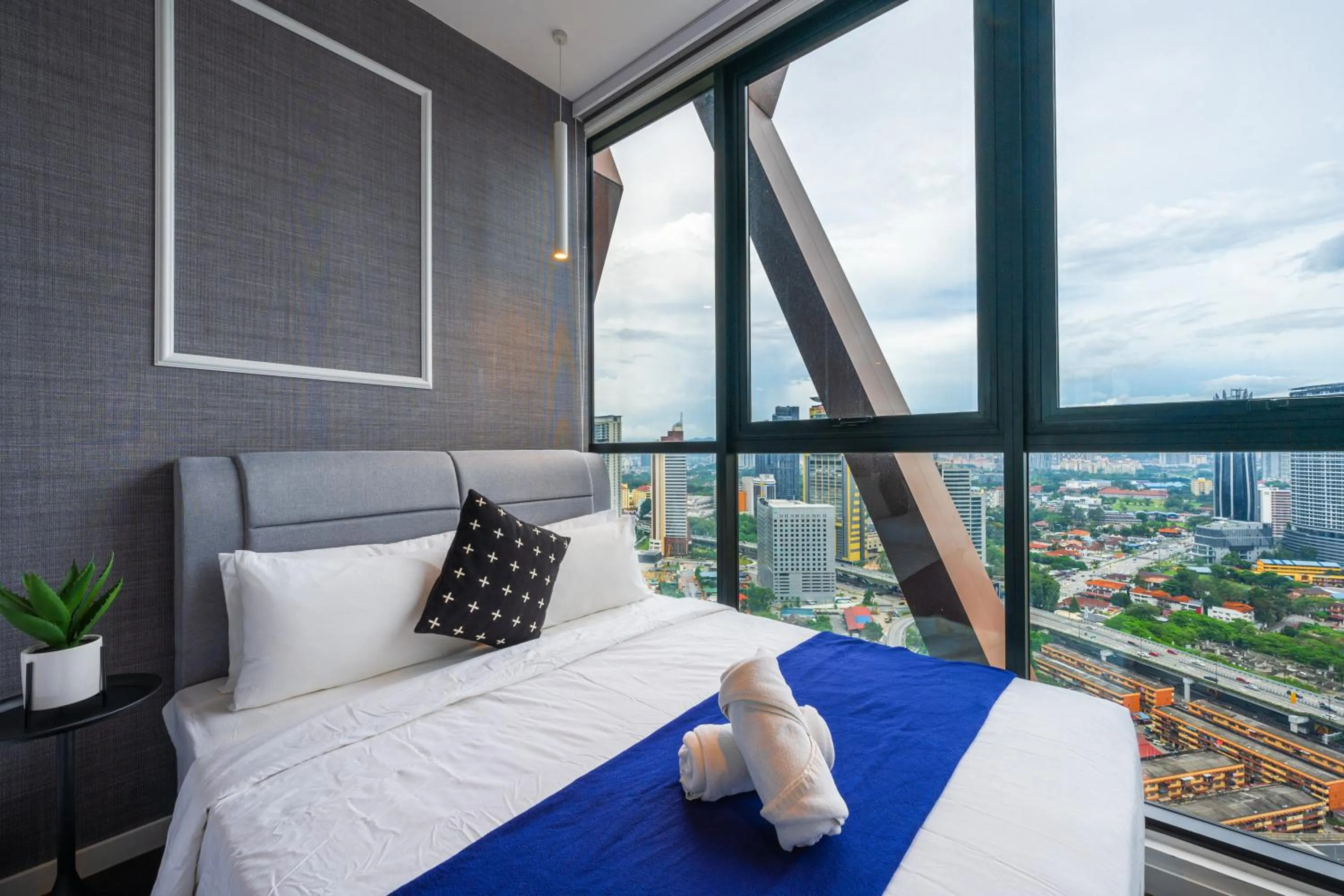 Bed in Greystone Scarletz Suites