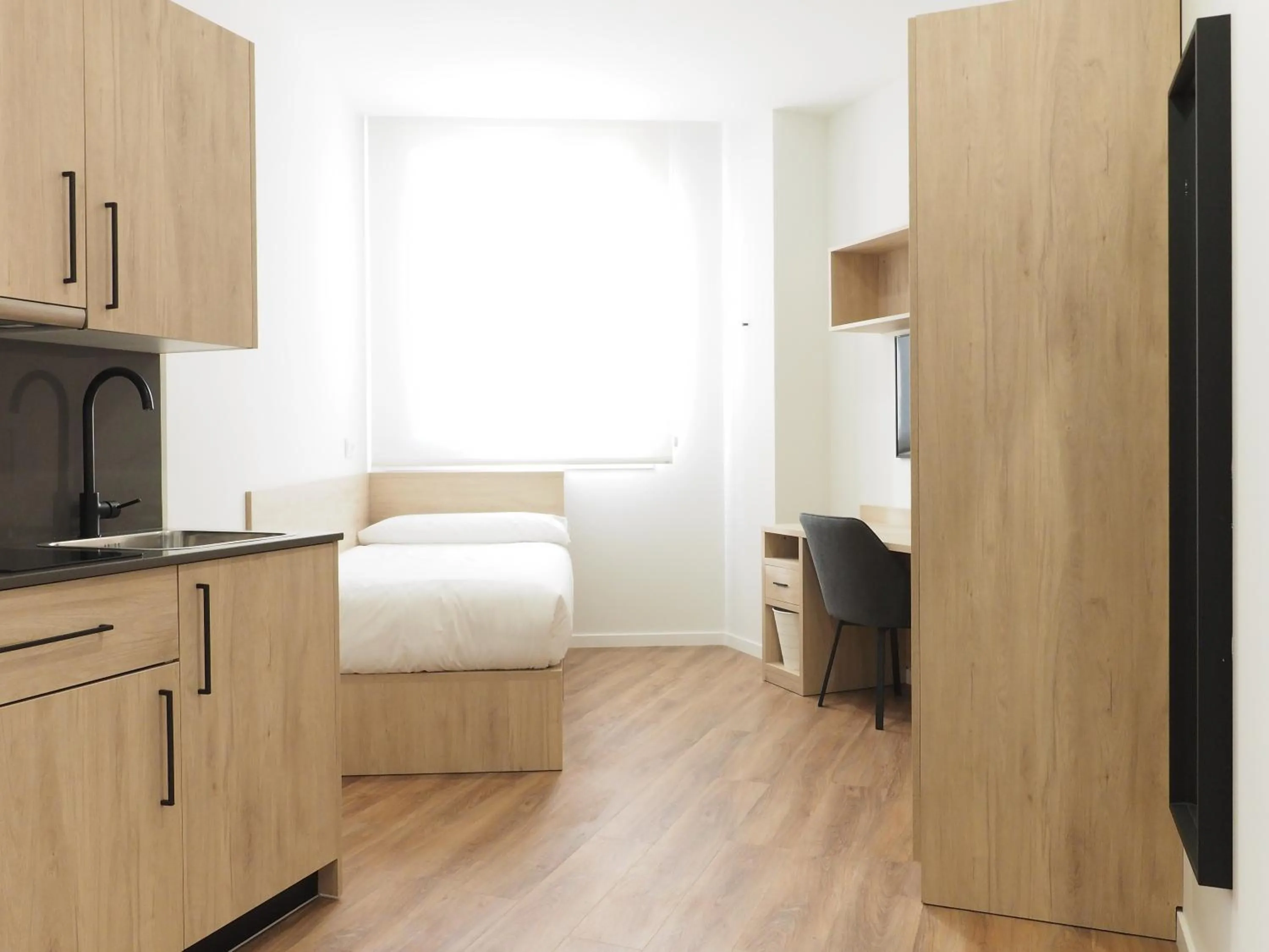 Kitchen or kitchenette, Bed in Micampus San Mamés Students Residence