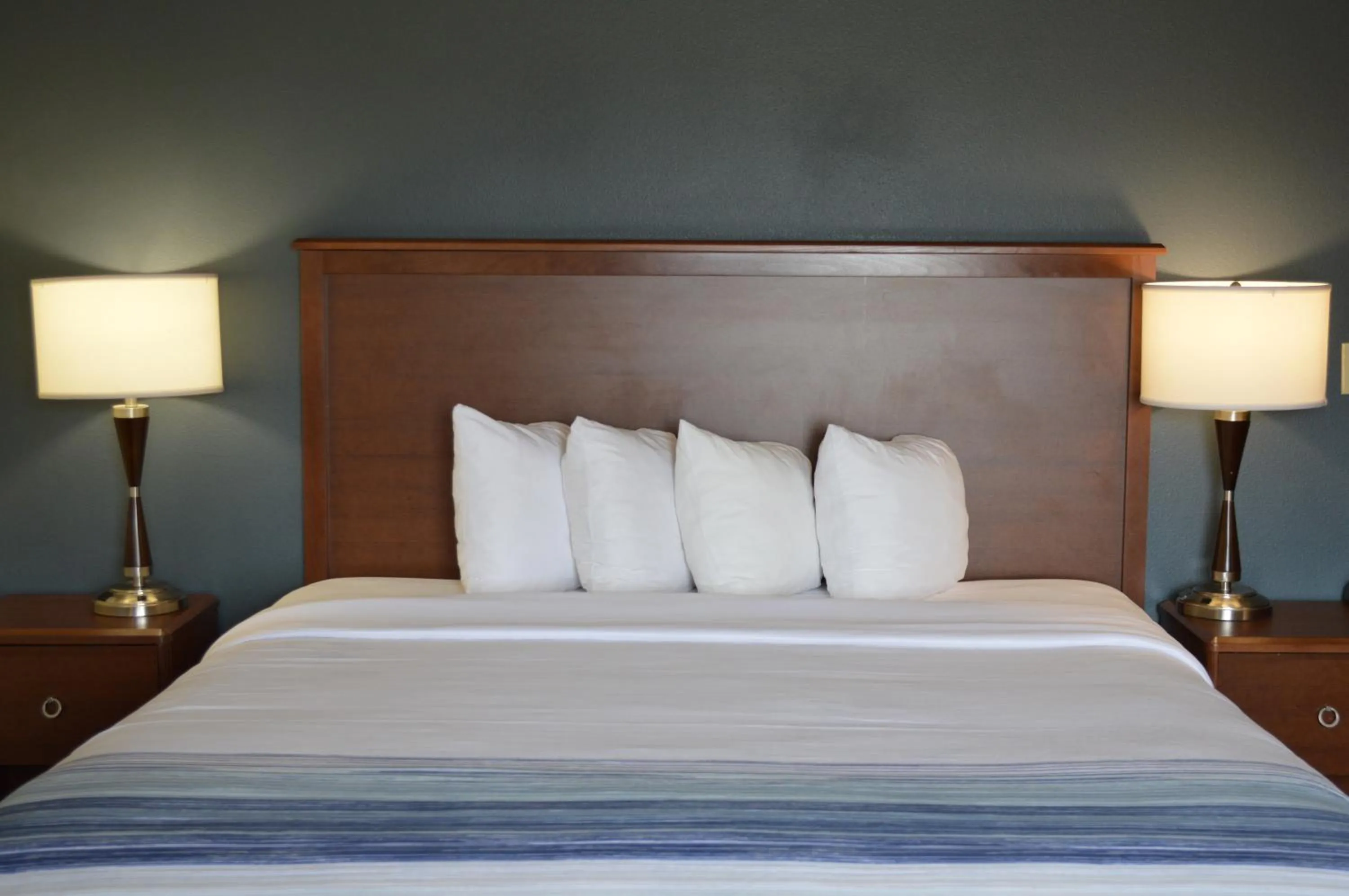 Bed in AmericInn by Wyndham Spencer