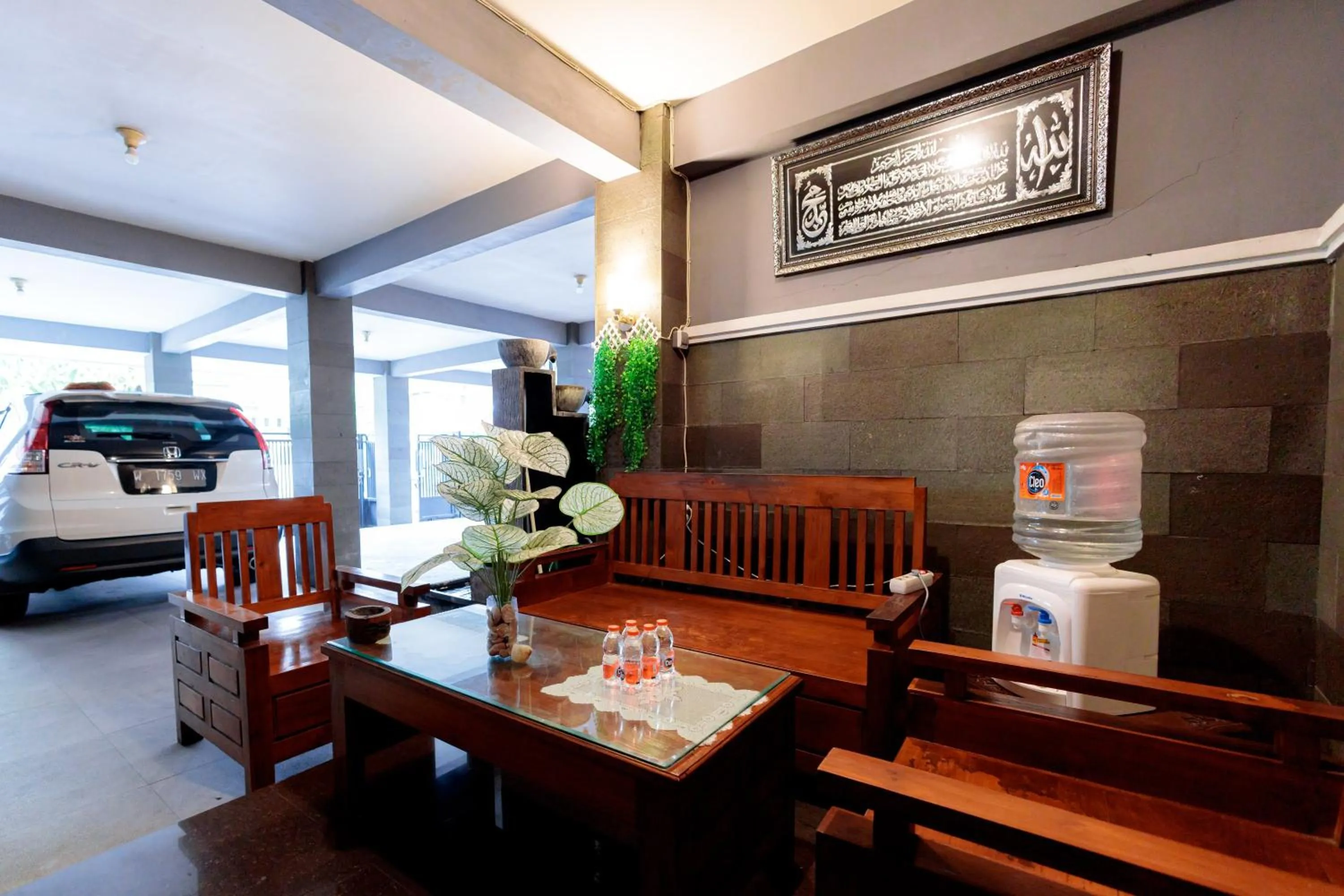 Seating area in RedDoorz Syariah at Delta Sari Aloha Waru