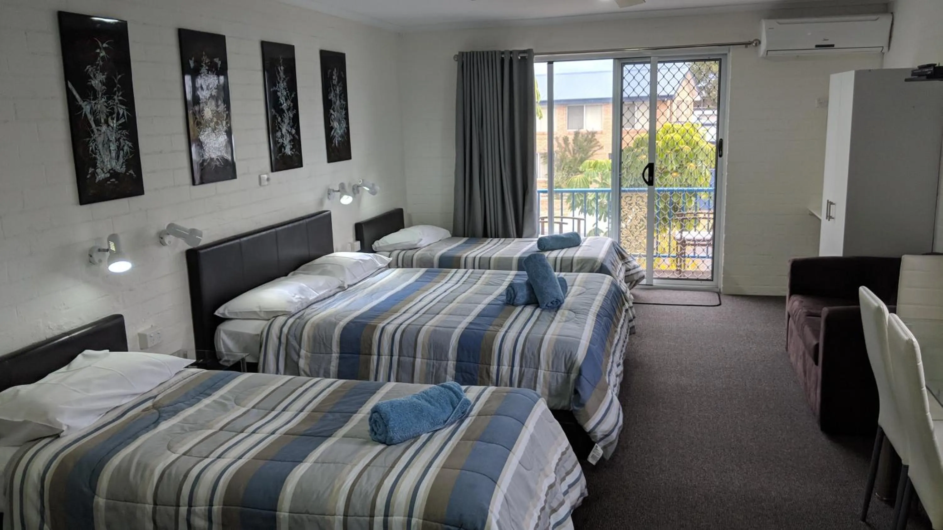 Bed in Harrington Village Motel