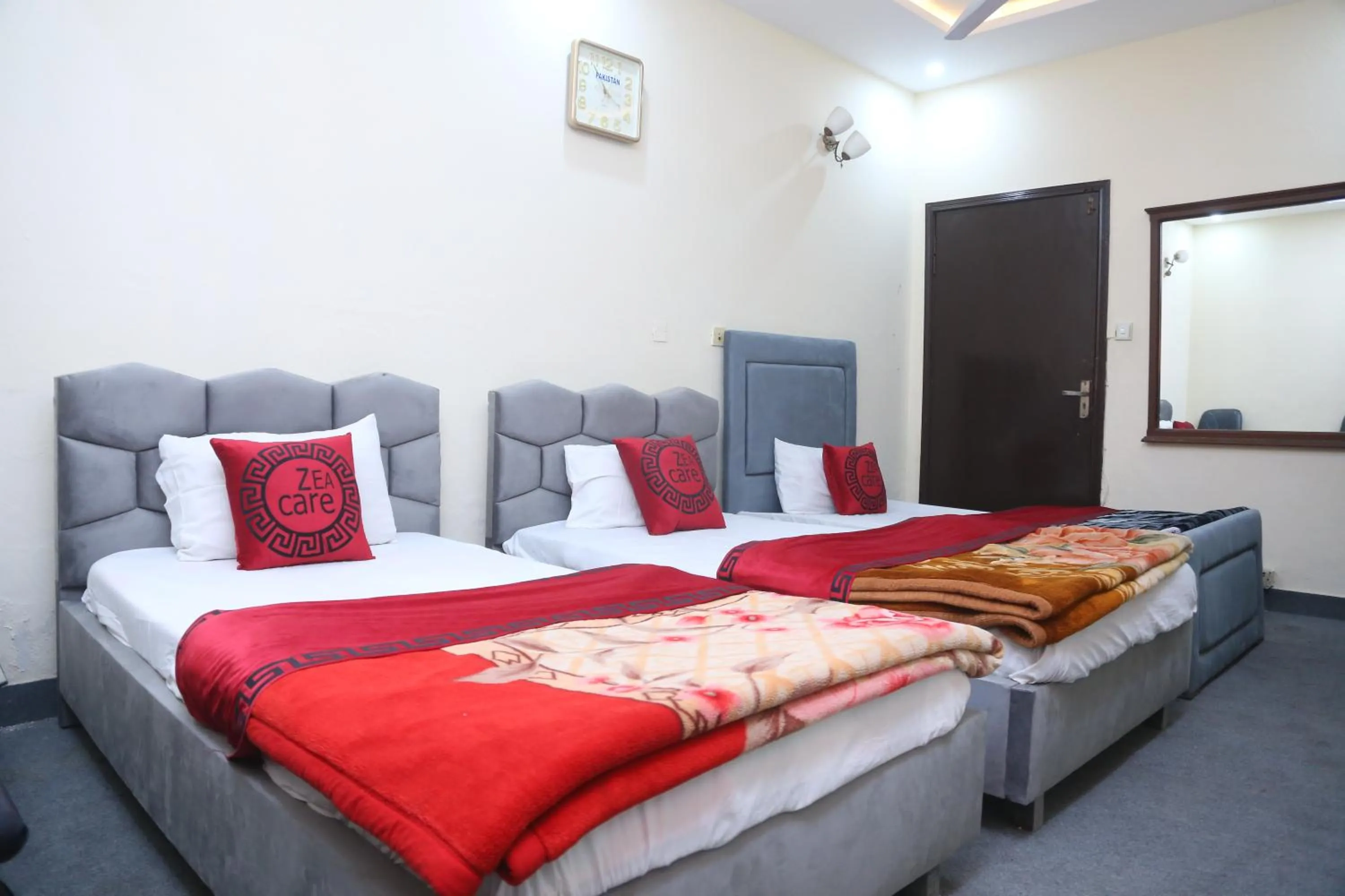 Living room, Bed in Hotel Zea Care Johar Town Lahore
