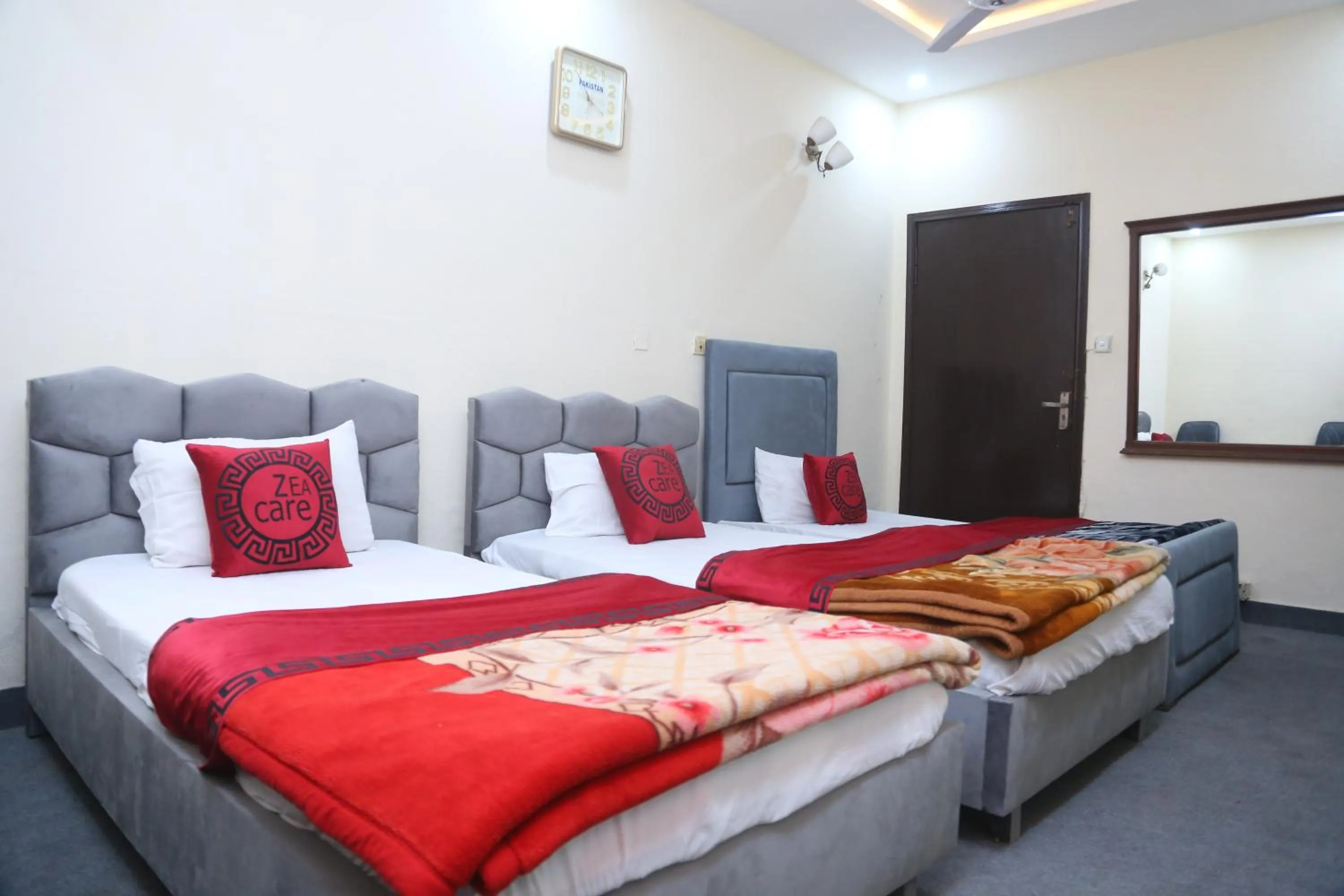 Living room, Bed in Hotel Zea Care Johar Town Lahore