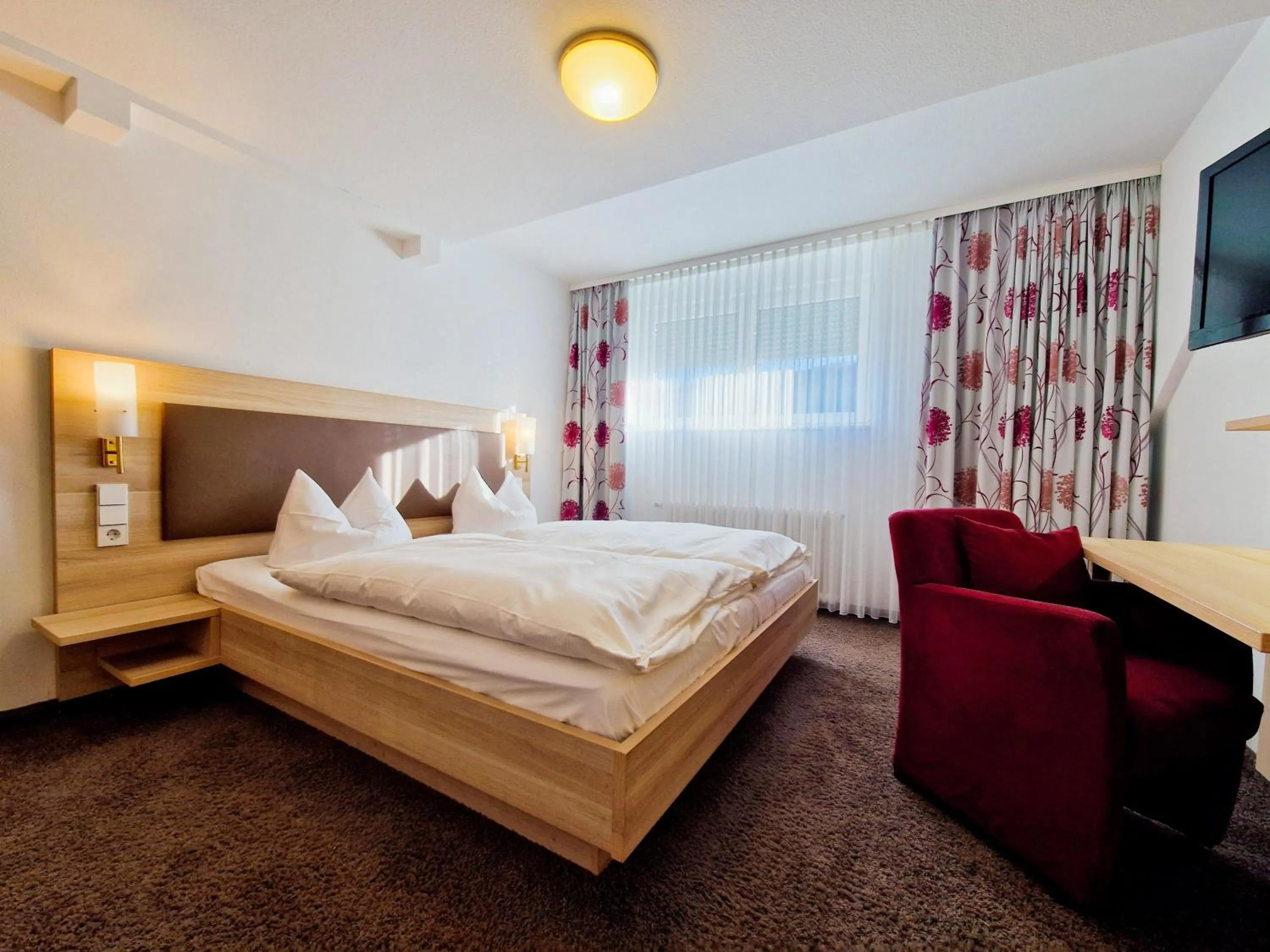 Bed in Blume Hausach I Hotel & Restaurant