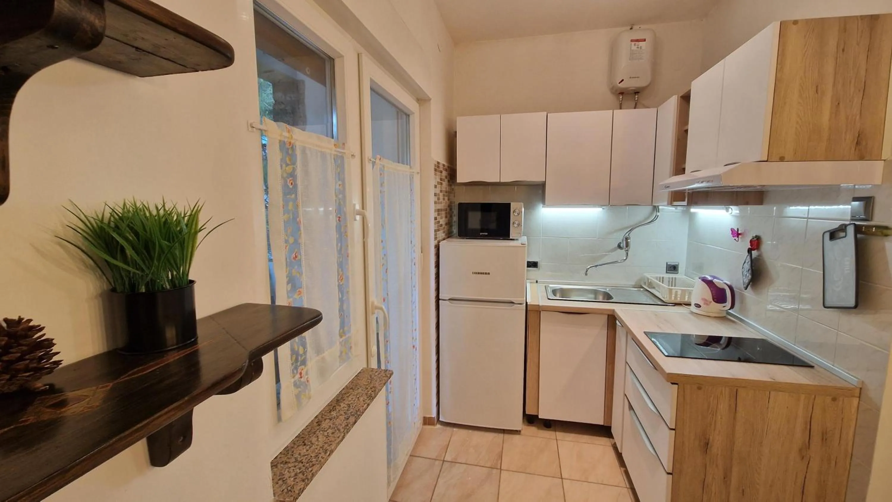 Kitchen or kitchenette in Apartments Godena
