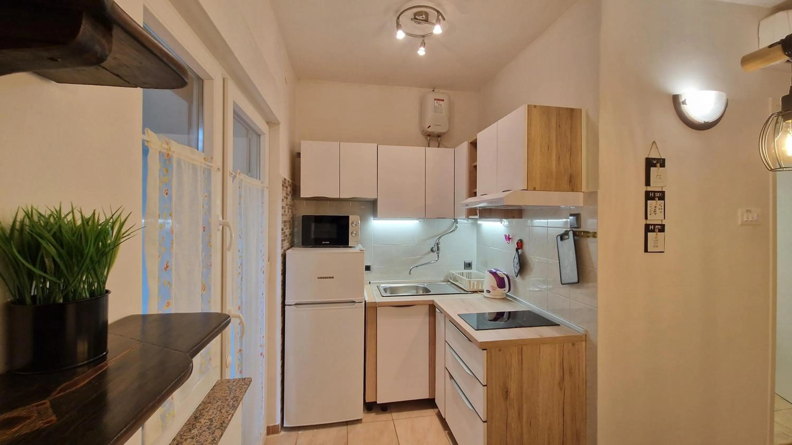 Kitchen or kitchenette in Apartments Godena