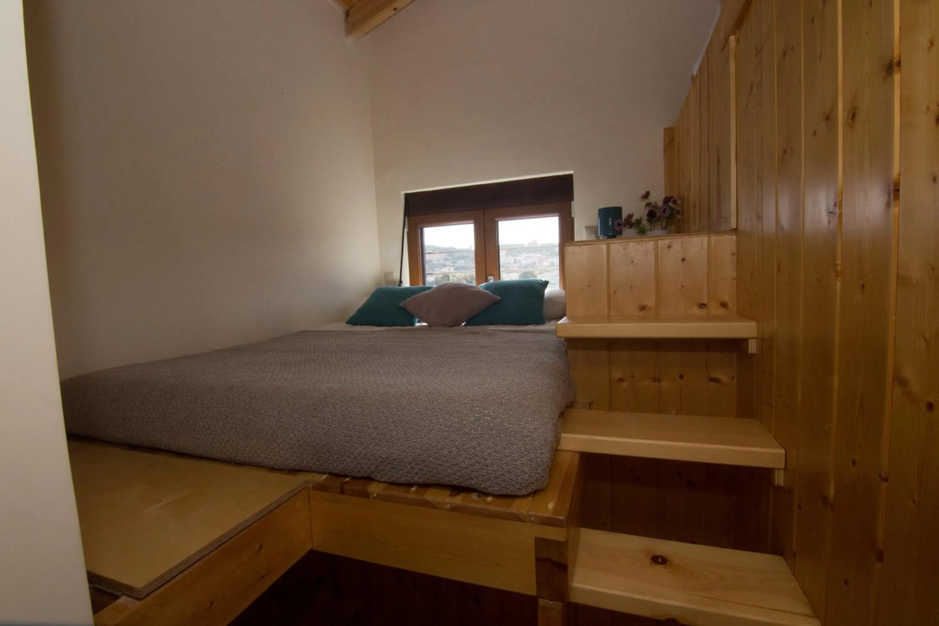 Bed in Asterias Studios & Apartments