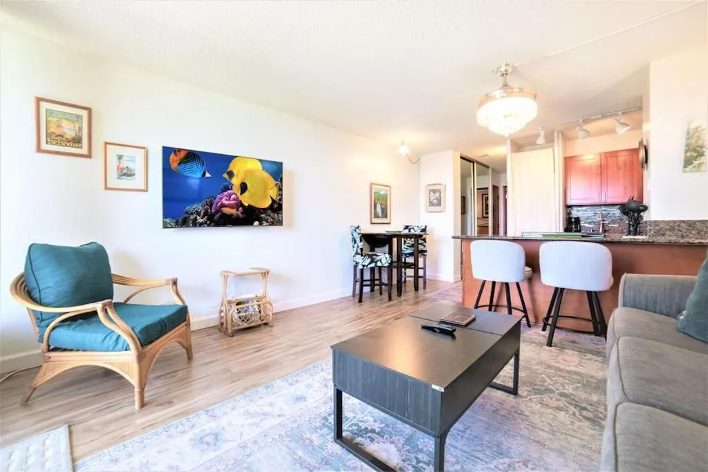 Living room in Stunning Maui Direct Ocean front on the beach, Walk to beach from Condo, Watch Turtles, Whales, AC in all rooms ocean view Pool and Spa
