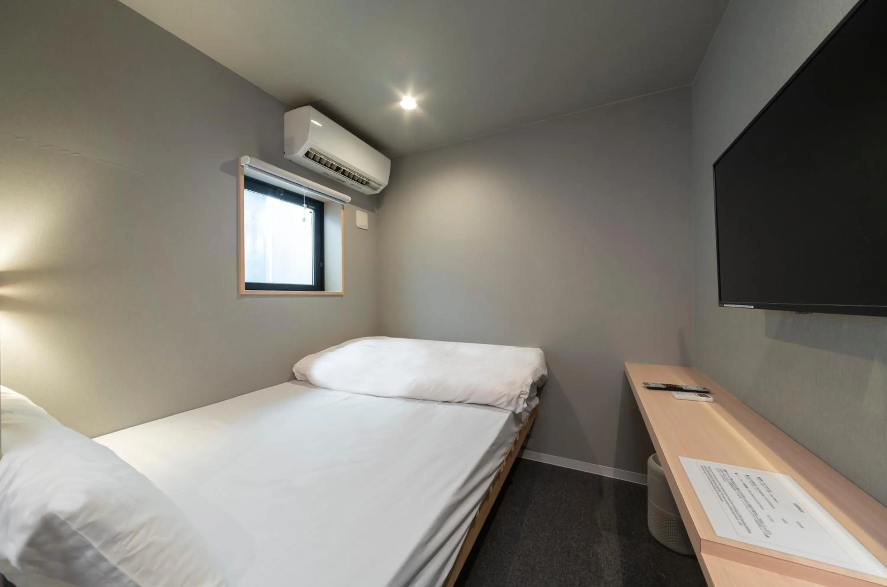 Photo of the whole room, Bed in Boxi Hakata 1