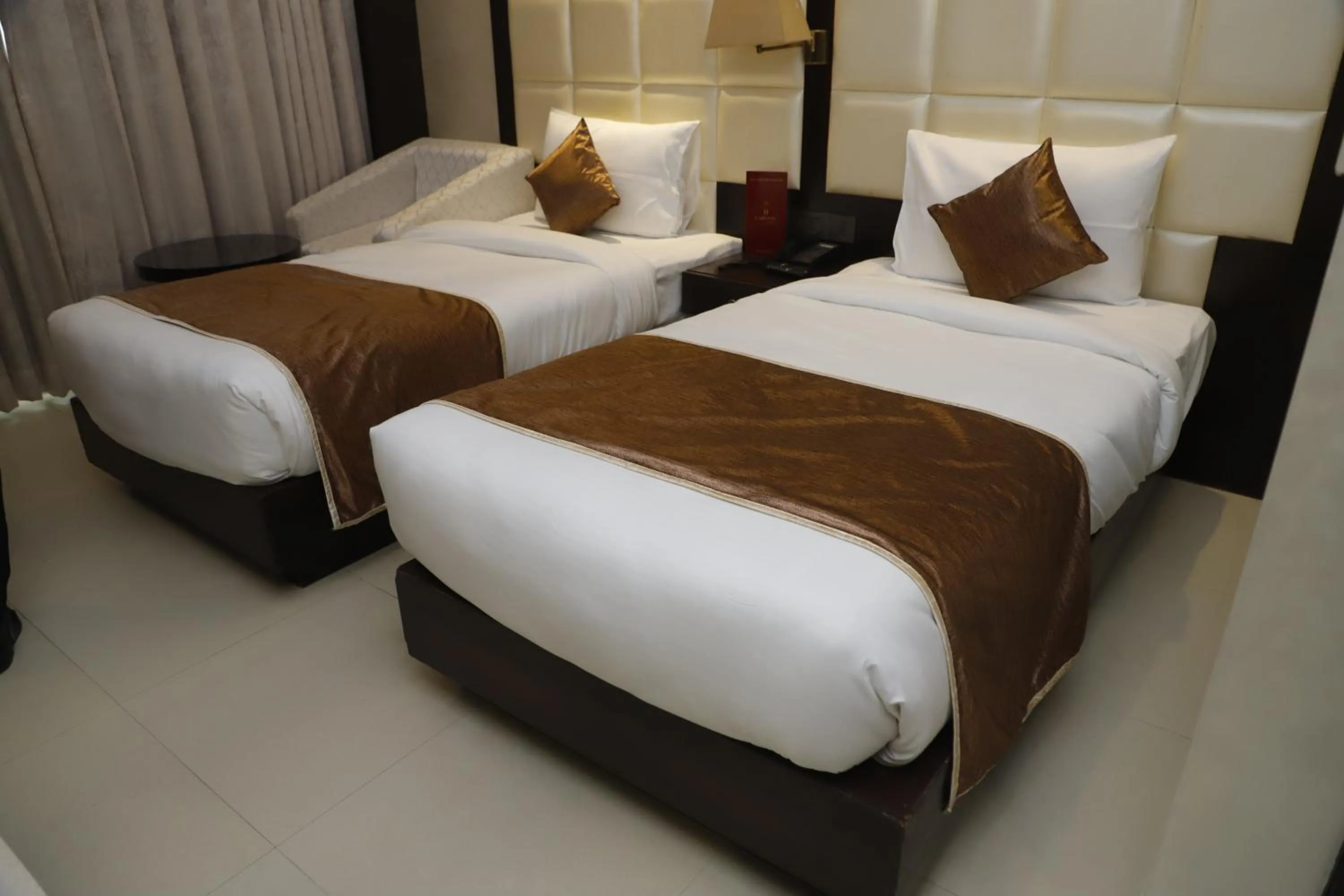 Bed in Udman Hotel at 18km from IGI Airport, By Ferns N Petals, Chattarpur, Delhi