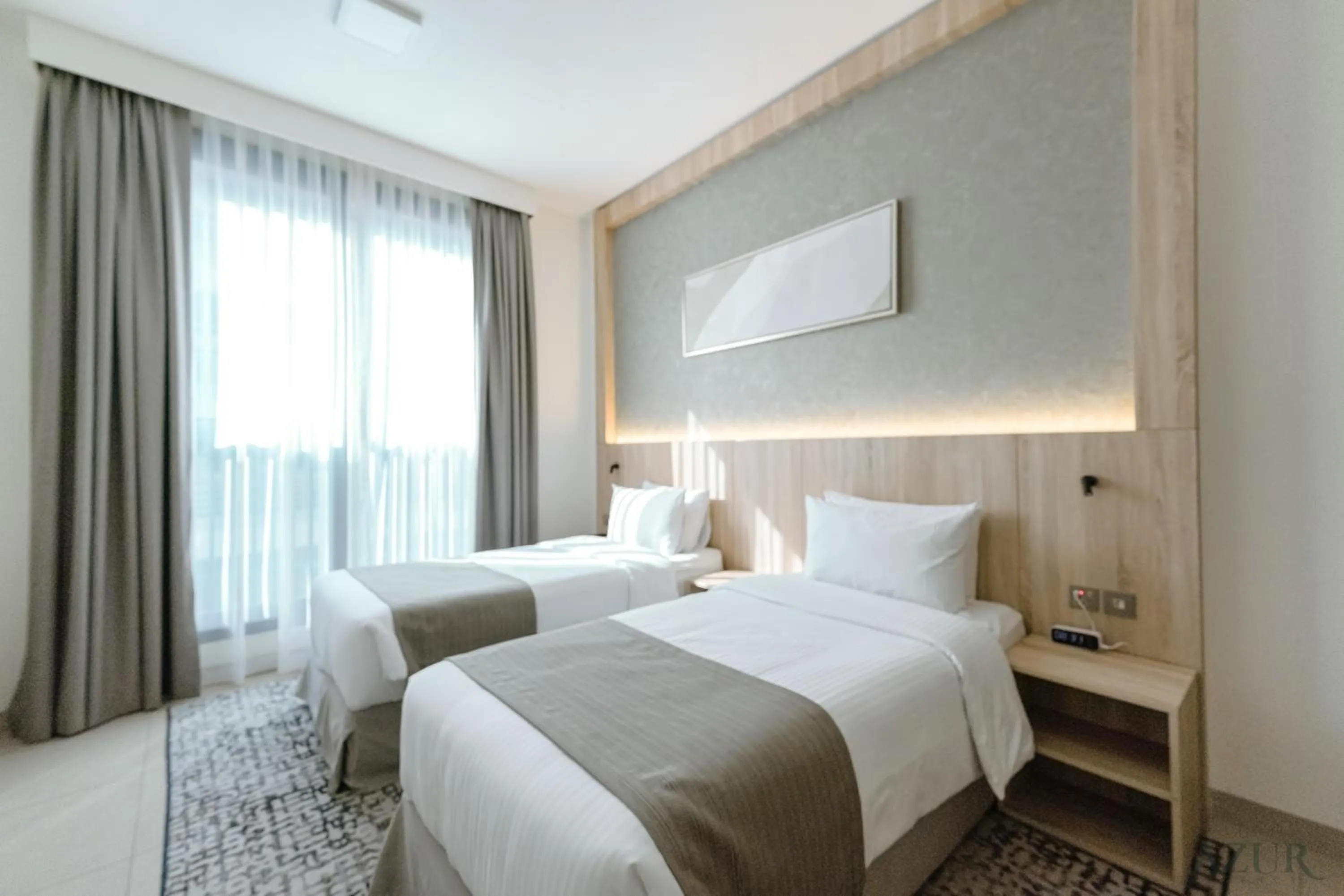 Bed in Azur Regency Hotel Apartments