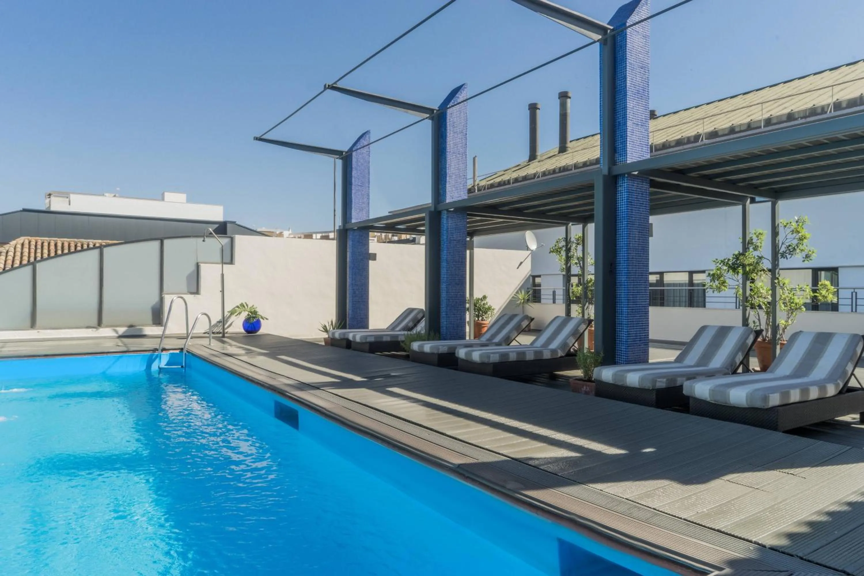 Swimming pool in AC Hotel Ciudad de Sevilla by Marriott