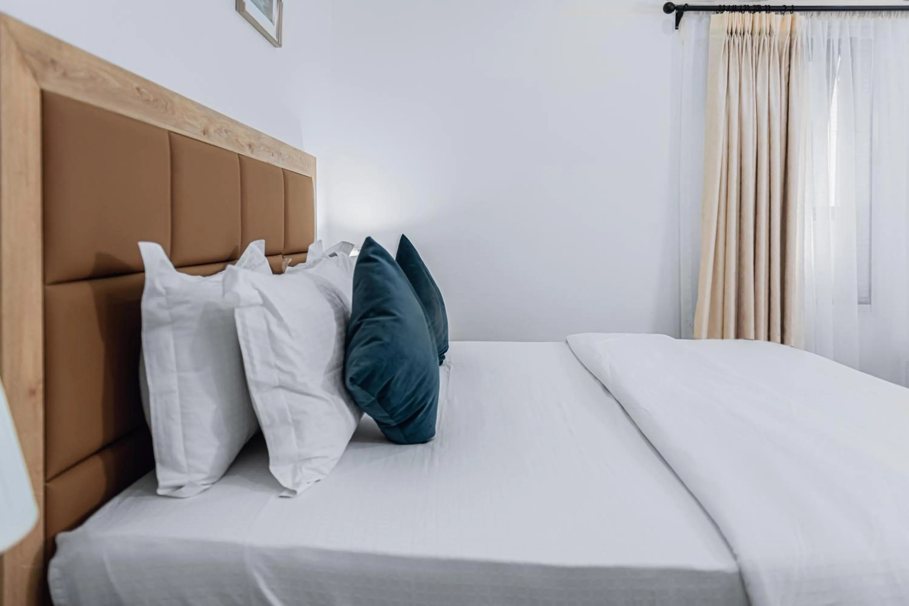 Bed in Quest Boutique Hotel