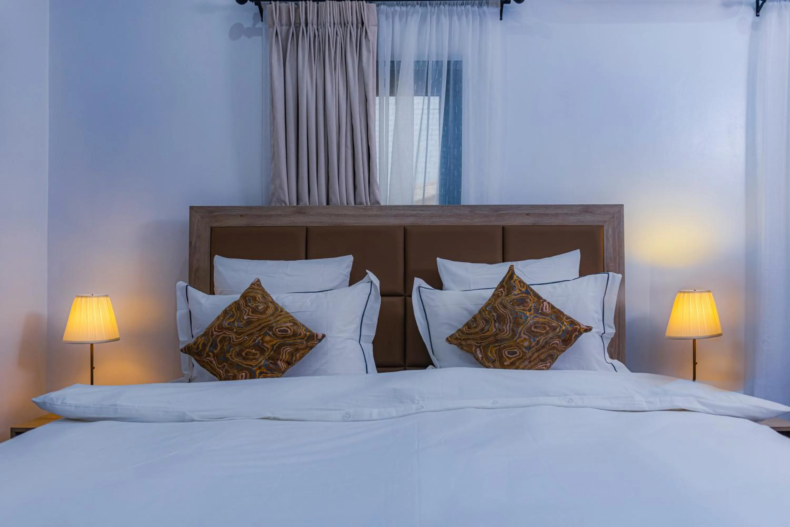 Bed in Quest Boutique Hotel