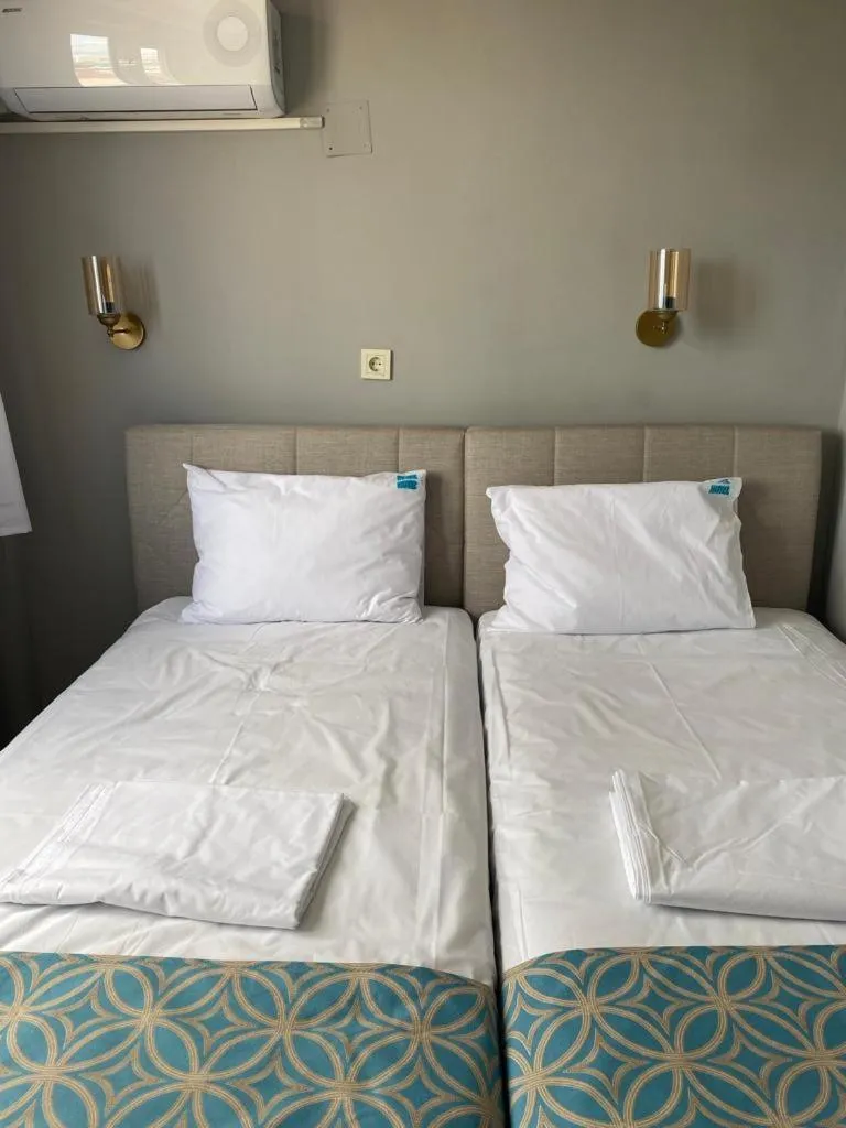 Bed in GRAND Deniz Hotel