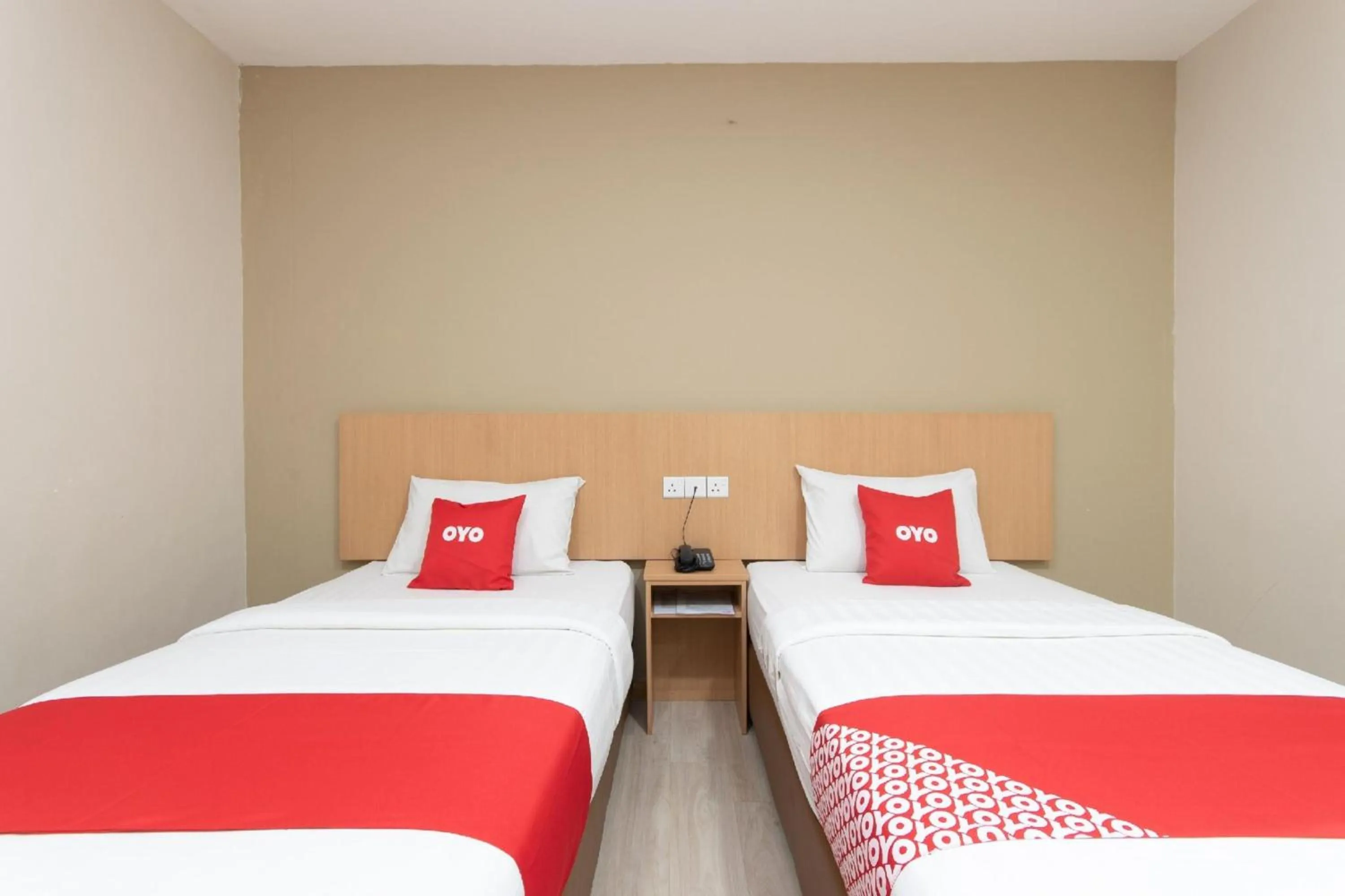 Bedroom in Capital O 89344 Labuan Avenue Hotel