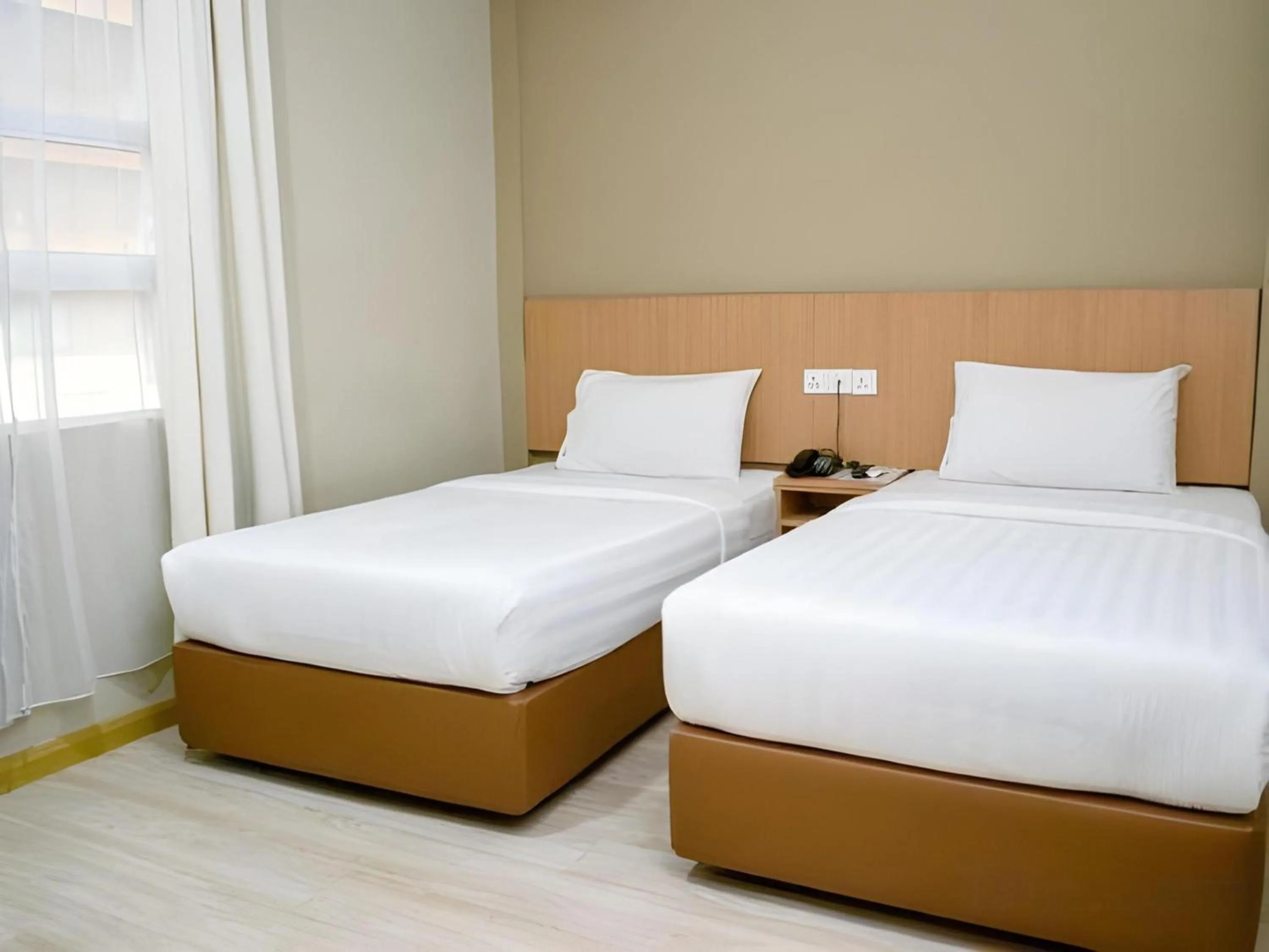 Photo of the whole room in Capital O 89344 Labuan Avenue Hotel