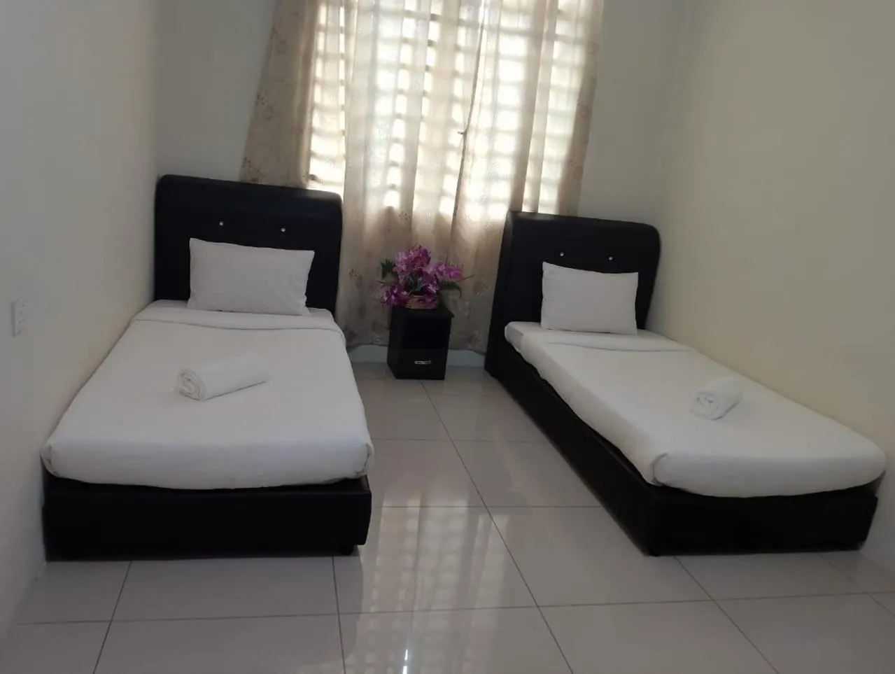 Bed in RNK BoutiQue HOTEL