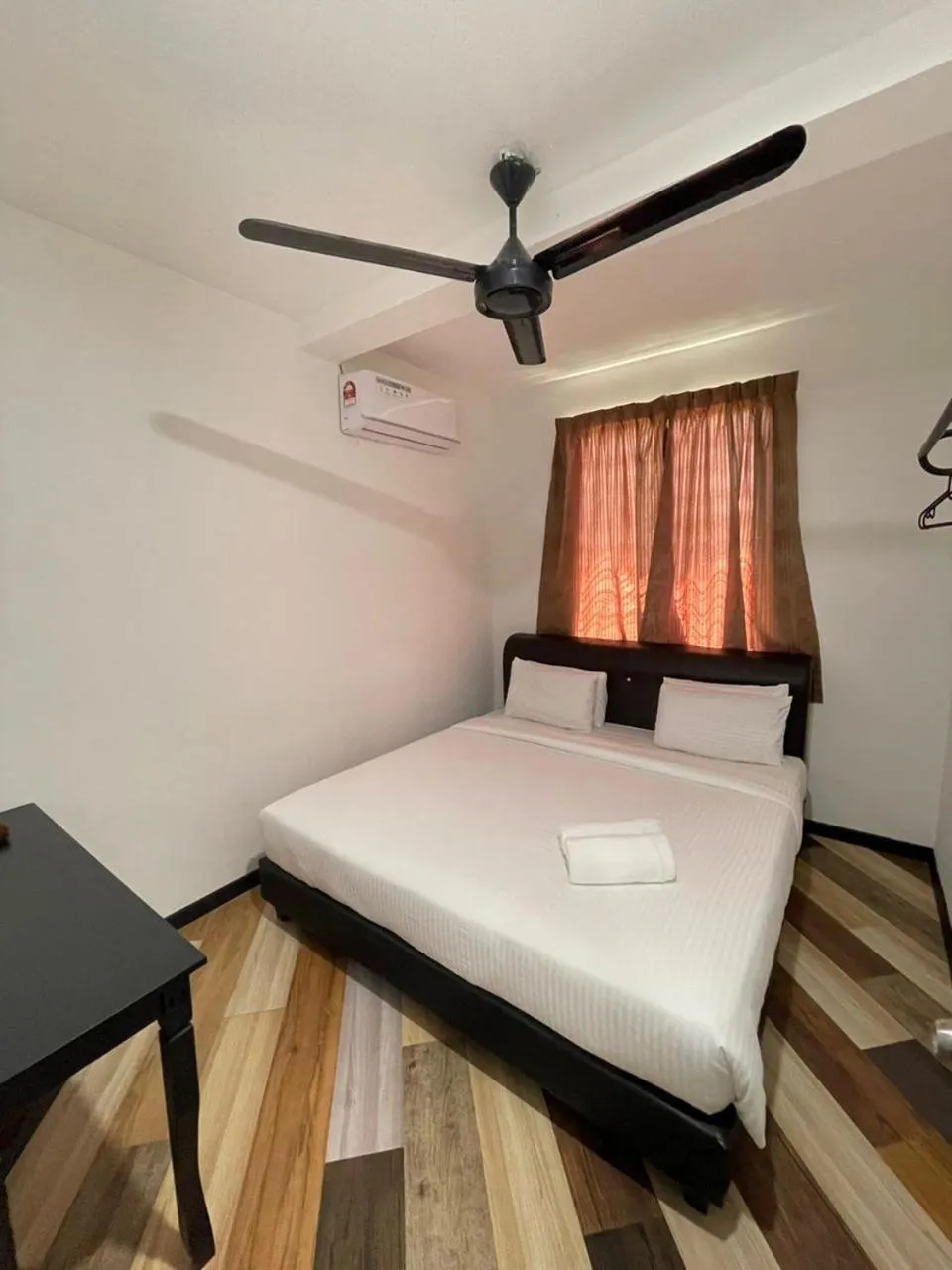 Bed in RNK BoutiQue HOTEL