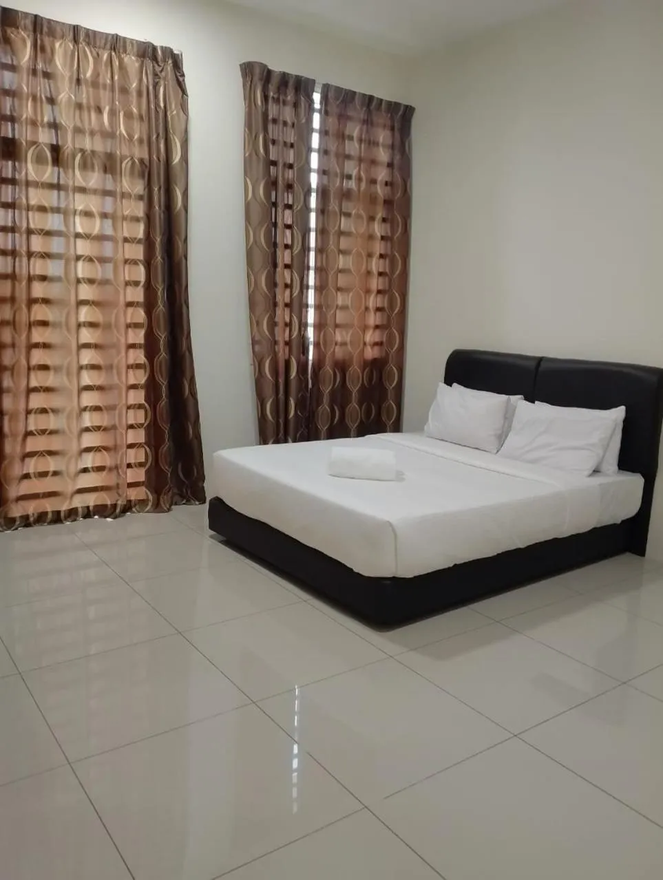 Bed in RNK BoutiQue HOTEL