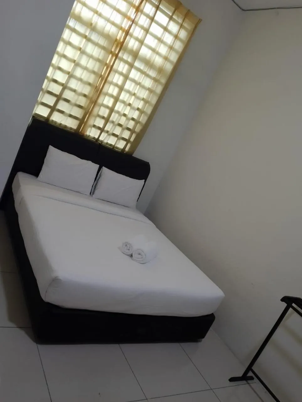 Bed in RNK BoutiQue HOTEL