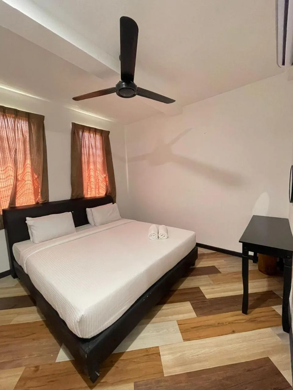 Bed in RNK BoutiQue HOTEL