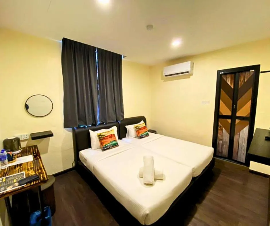 Bed in RNK BoutiQue HOTEL
