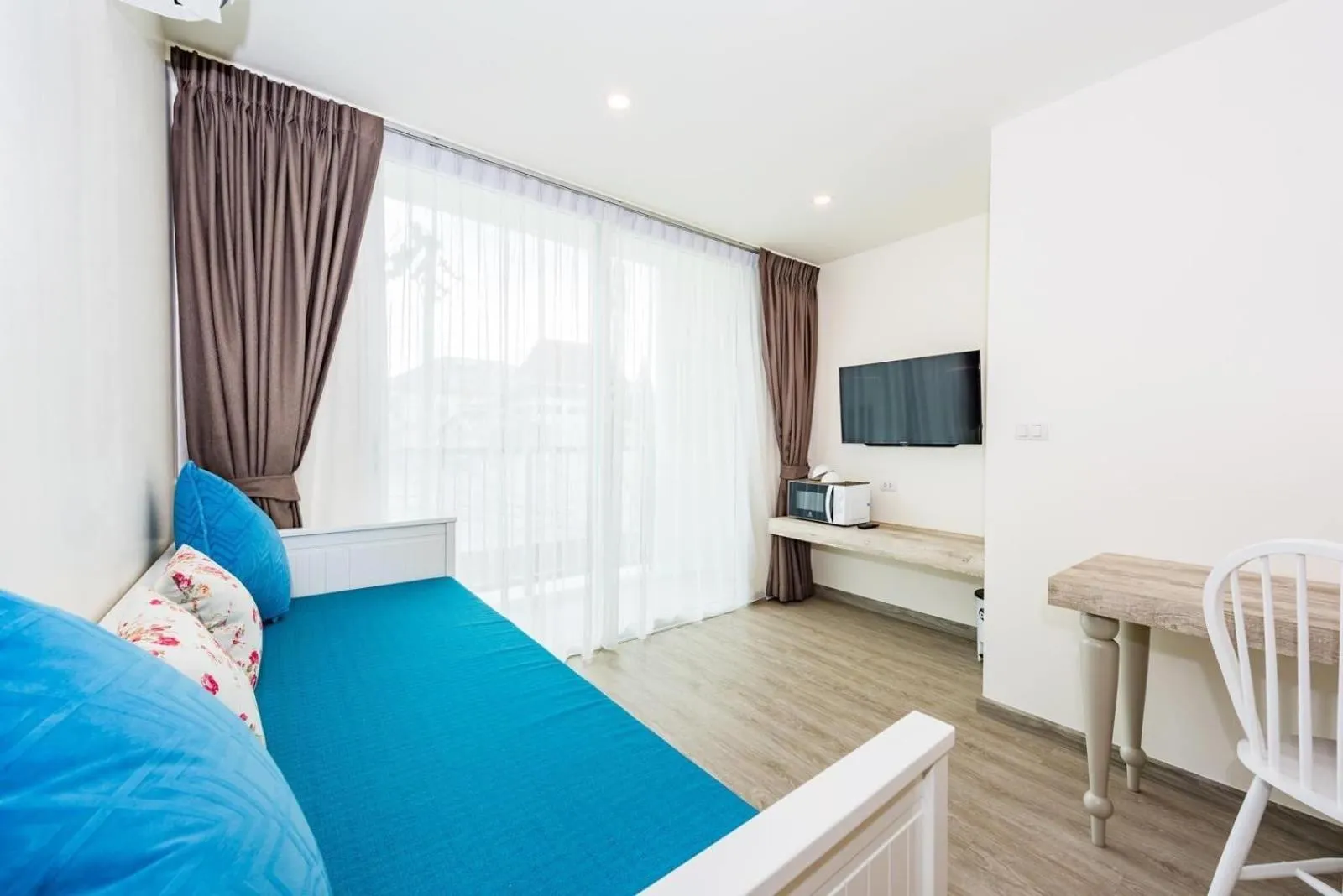 Living room, Bed in LullaBella Hotel Patong