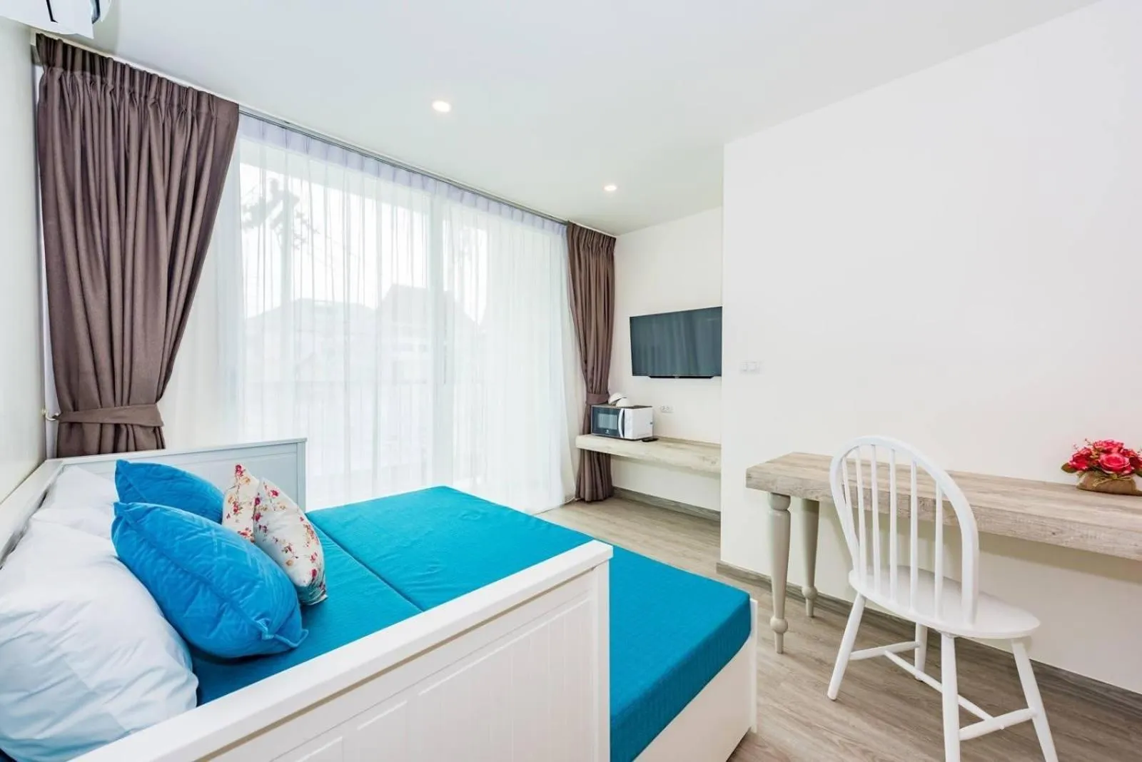 Living room, Bed in LullaBella Hotel Patong