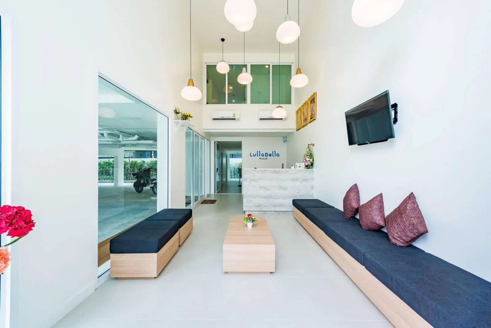 Communal lounge/ TV room in LullaBella Hotel Patong