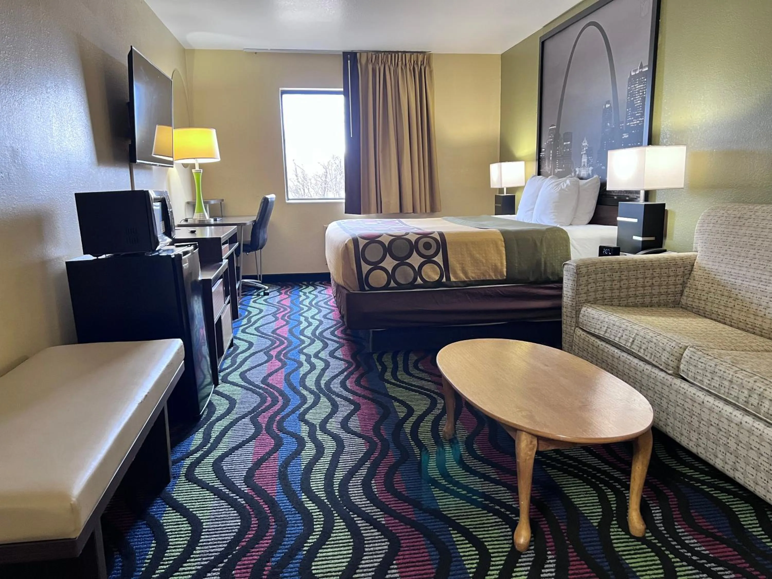 Seating area in Super 8 by Wyndham Farmington