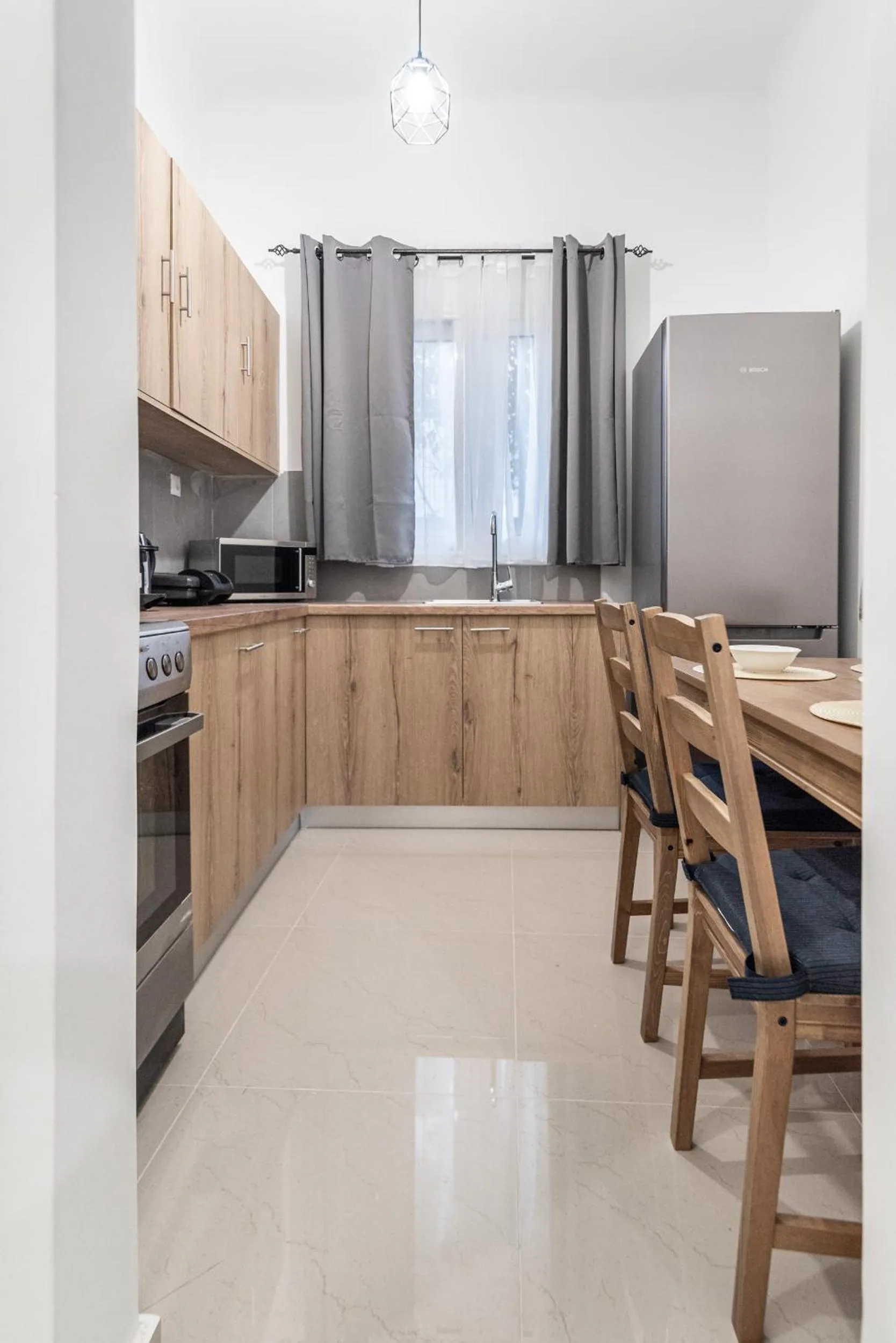 Kitchen or kitchenette in Blue Riviera villas & suites - Alimos 2