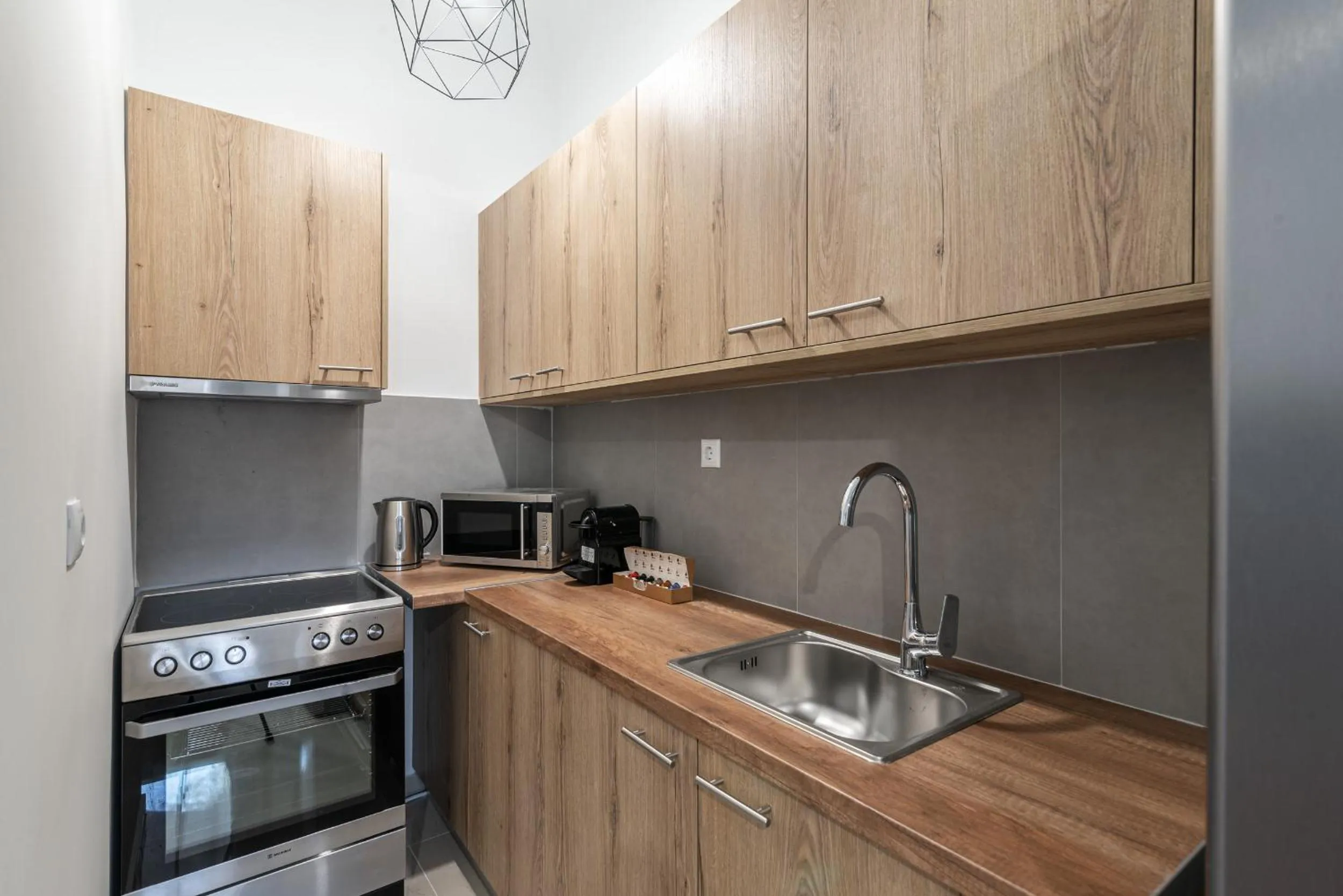 Kitchen or kitchenette in Blue Riviera villas & suites - Alimos 2