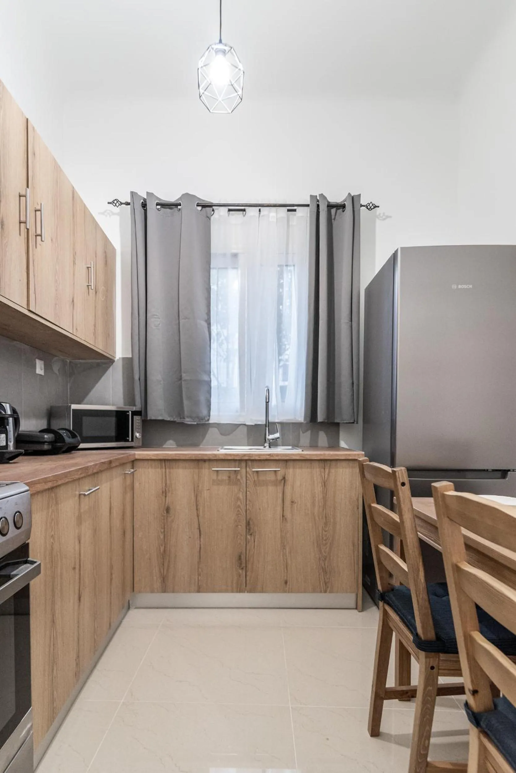 Kitchen or kitchenette in Blue Riviera villas & suites - Alimos 2