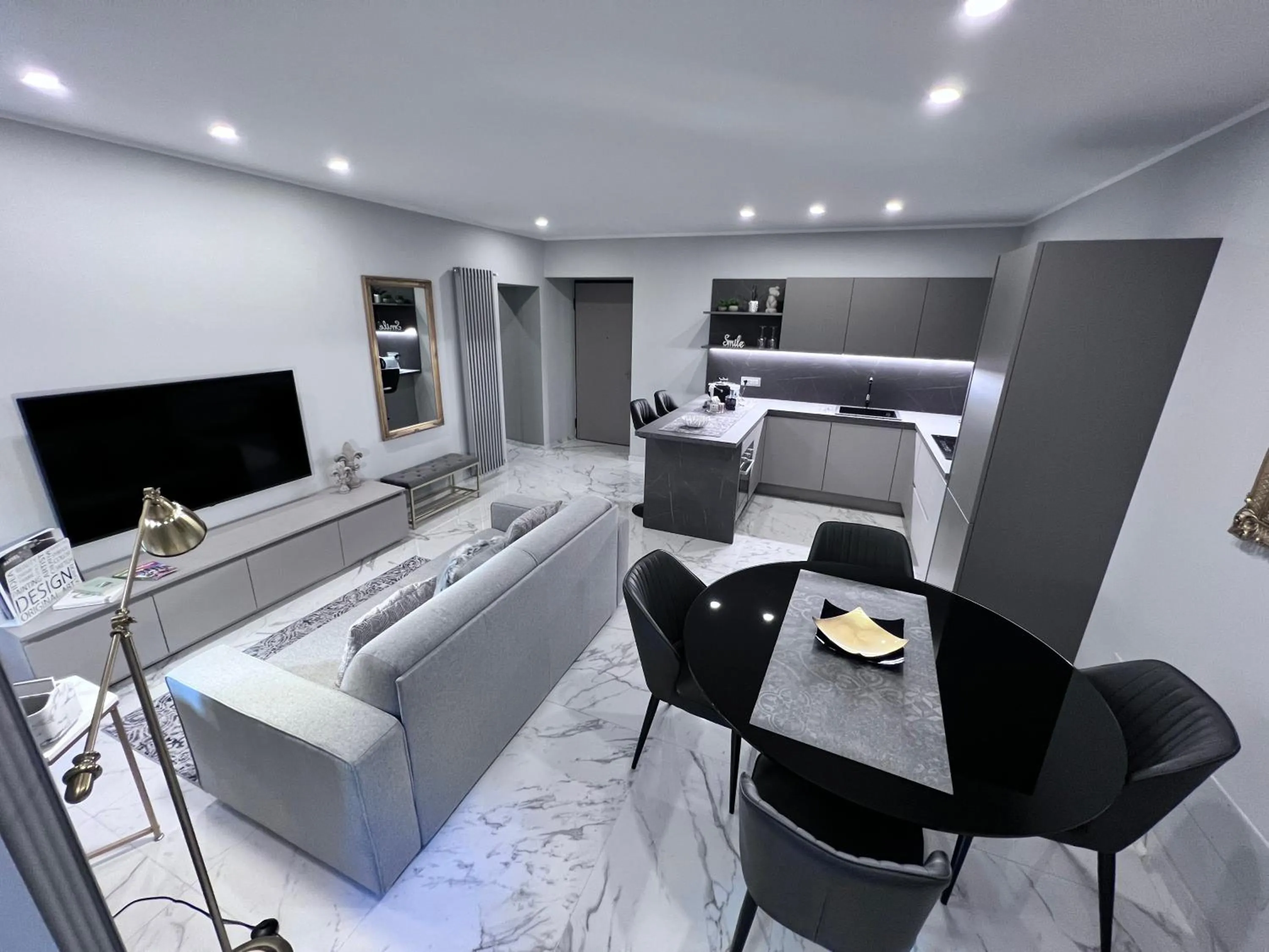 Seating area, Bed in Le Porte luxury apartment