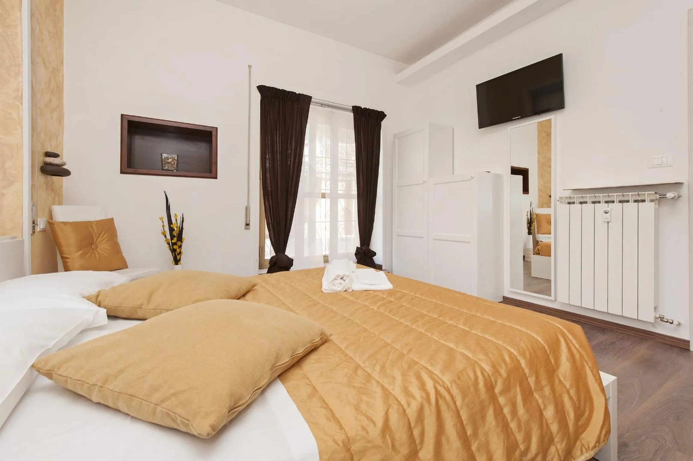 Photo of the whole room, Bed in De Guestibus