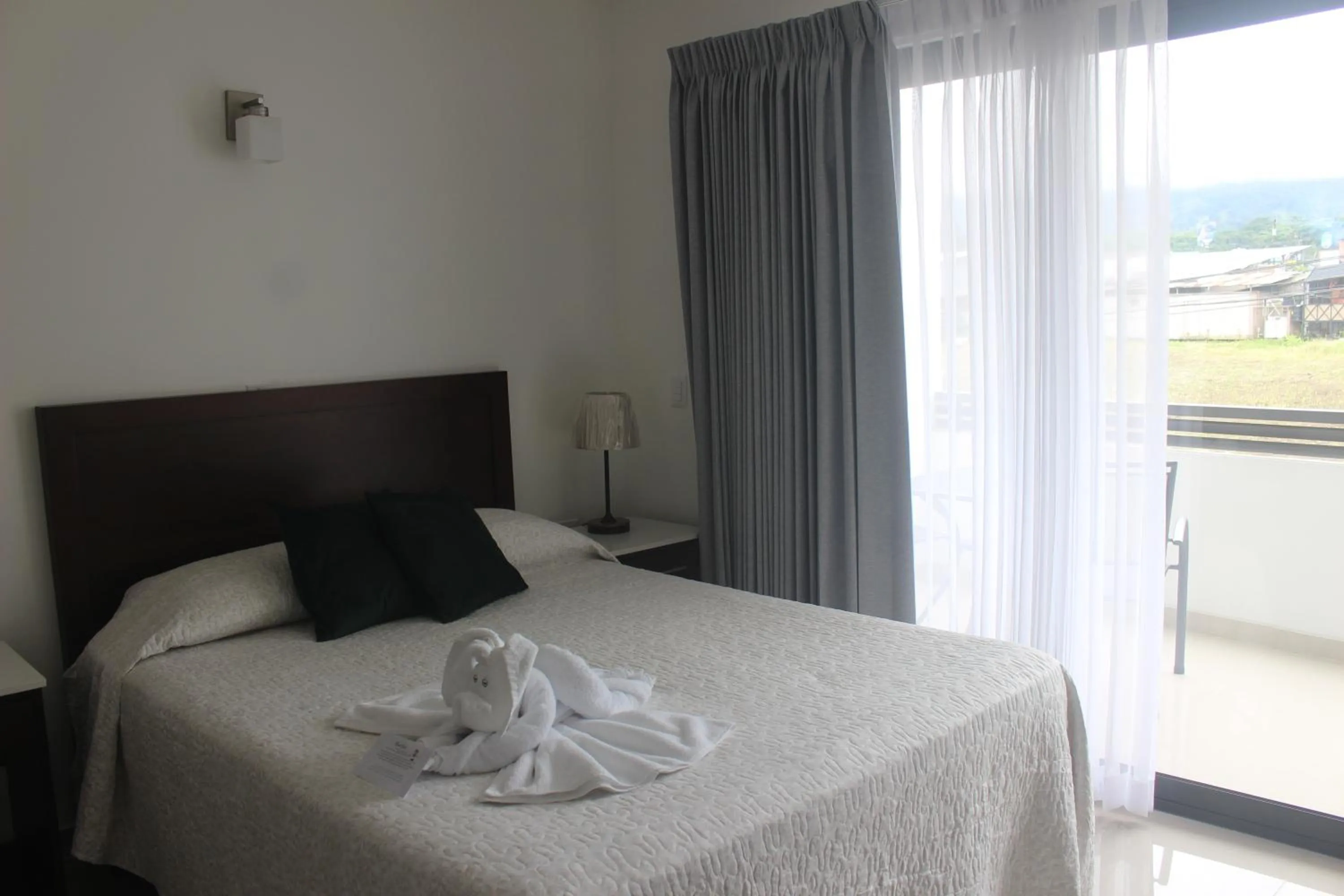 Photo of the whole room, Bed in Hotel Arenal by Regina