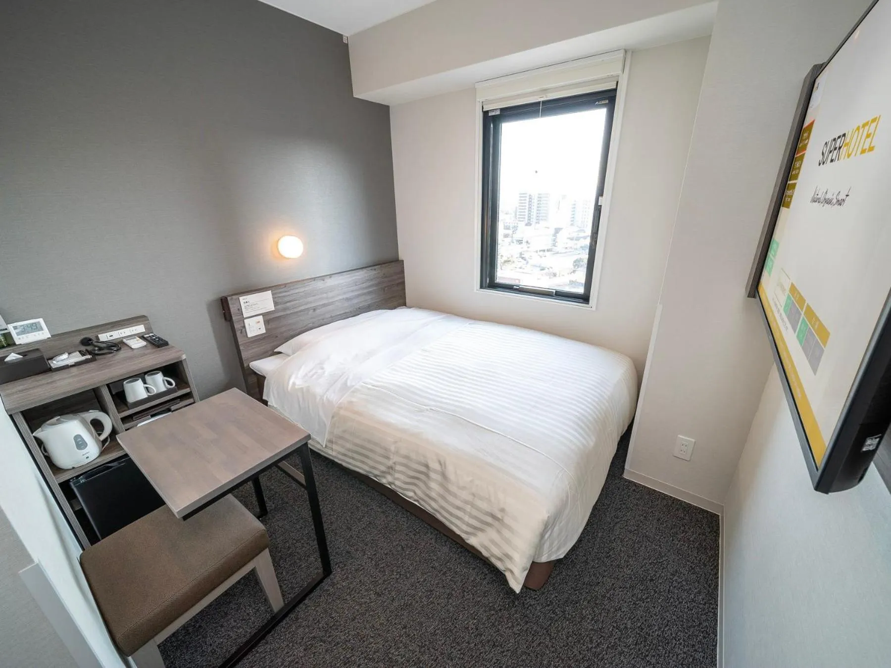 Bed in Super Hotel Kumamoto Ekimae Natural Hot Springs