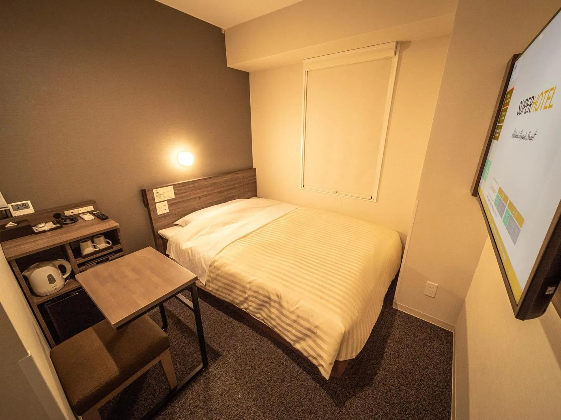 Bed in Super Hotel Kumamoto Ekimae Natural Hot Springs
