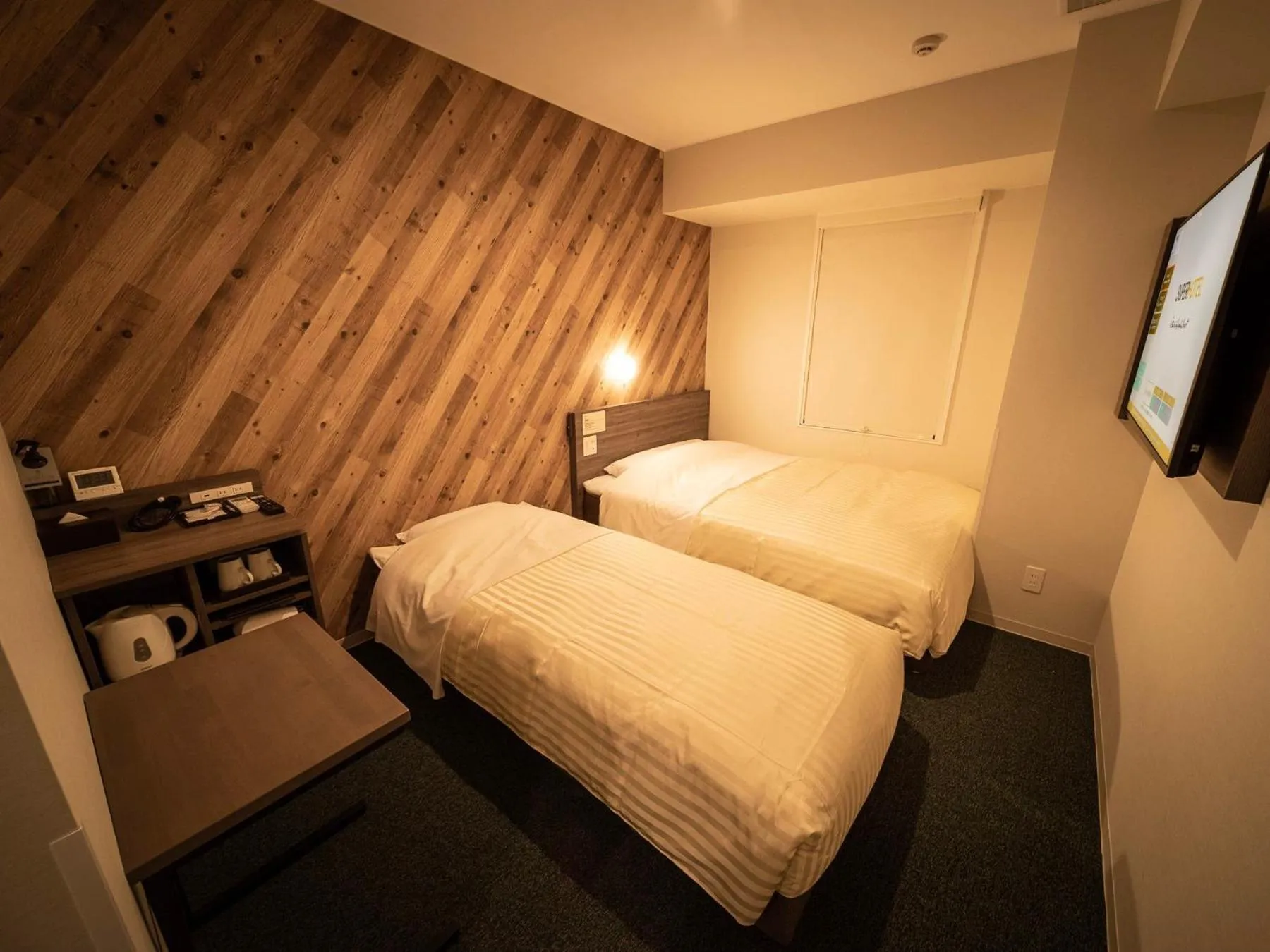Bed in Super Hotel Kumamoto Ekimae Natural Hot Springs