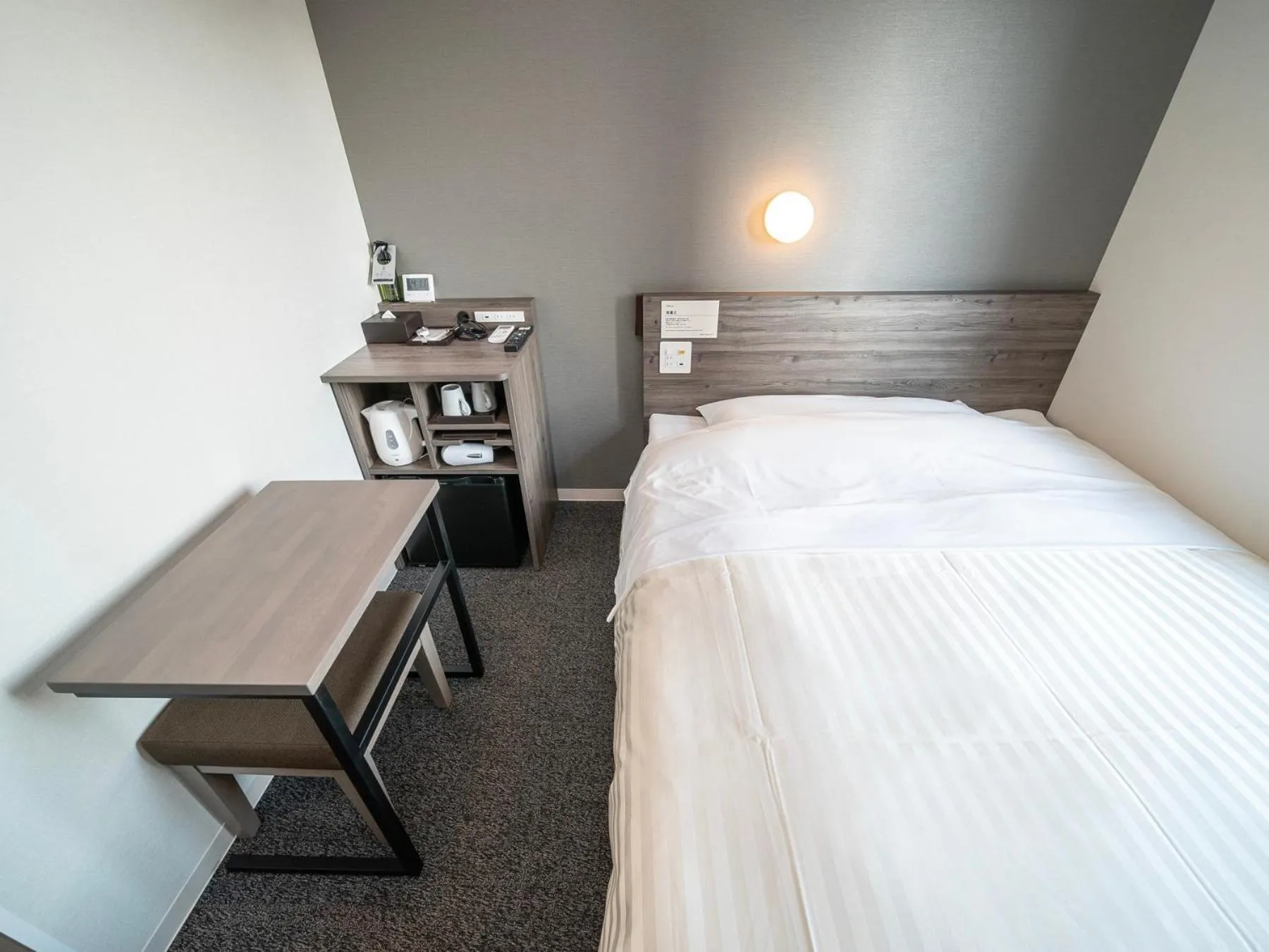 Bed in Super Hotel Kumamoto Ekimae Natural Hot Springs