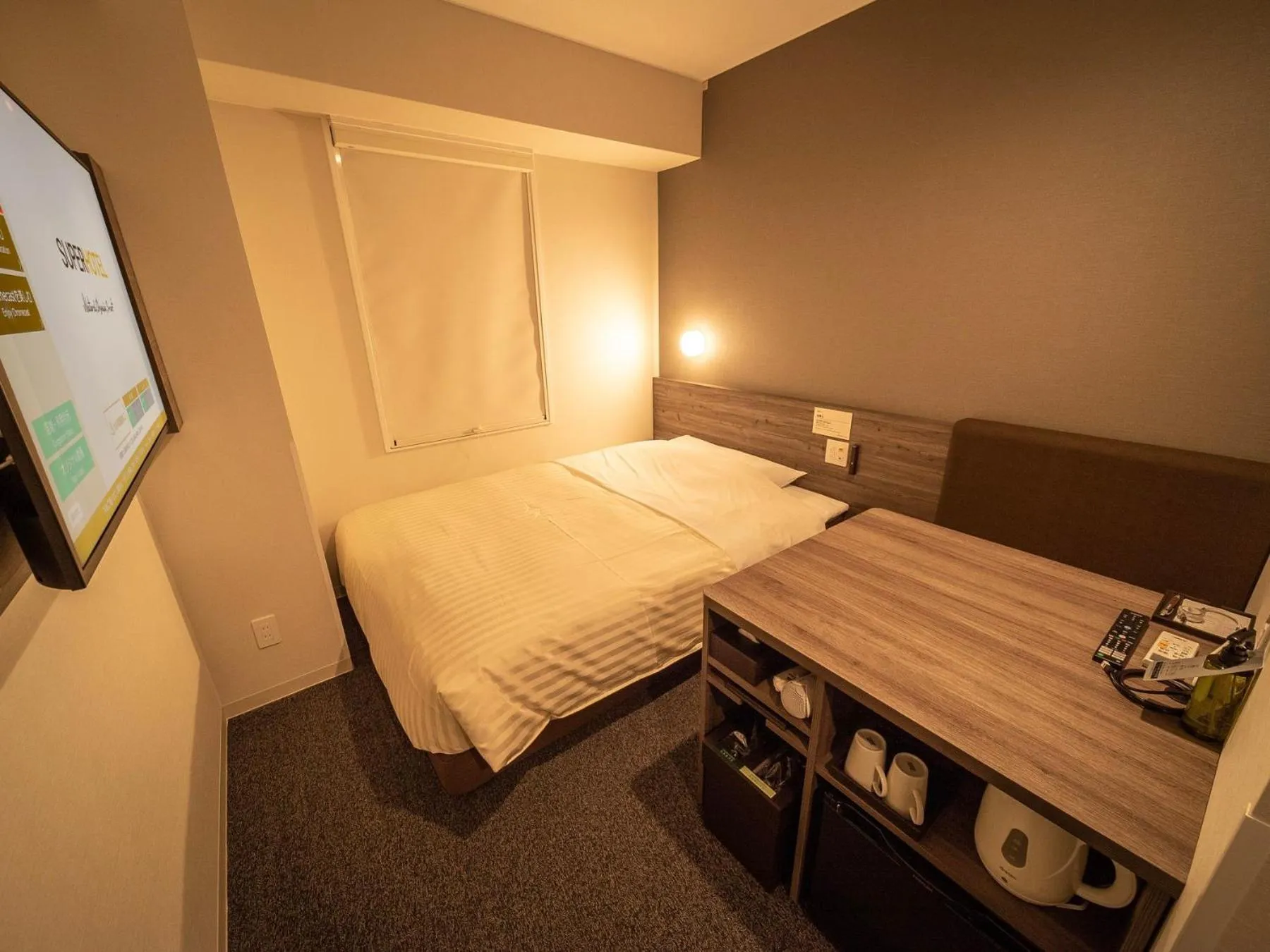 Bed in Super Hotel Kumamoto Ekimae Natural Hot Springs