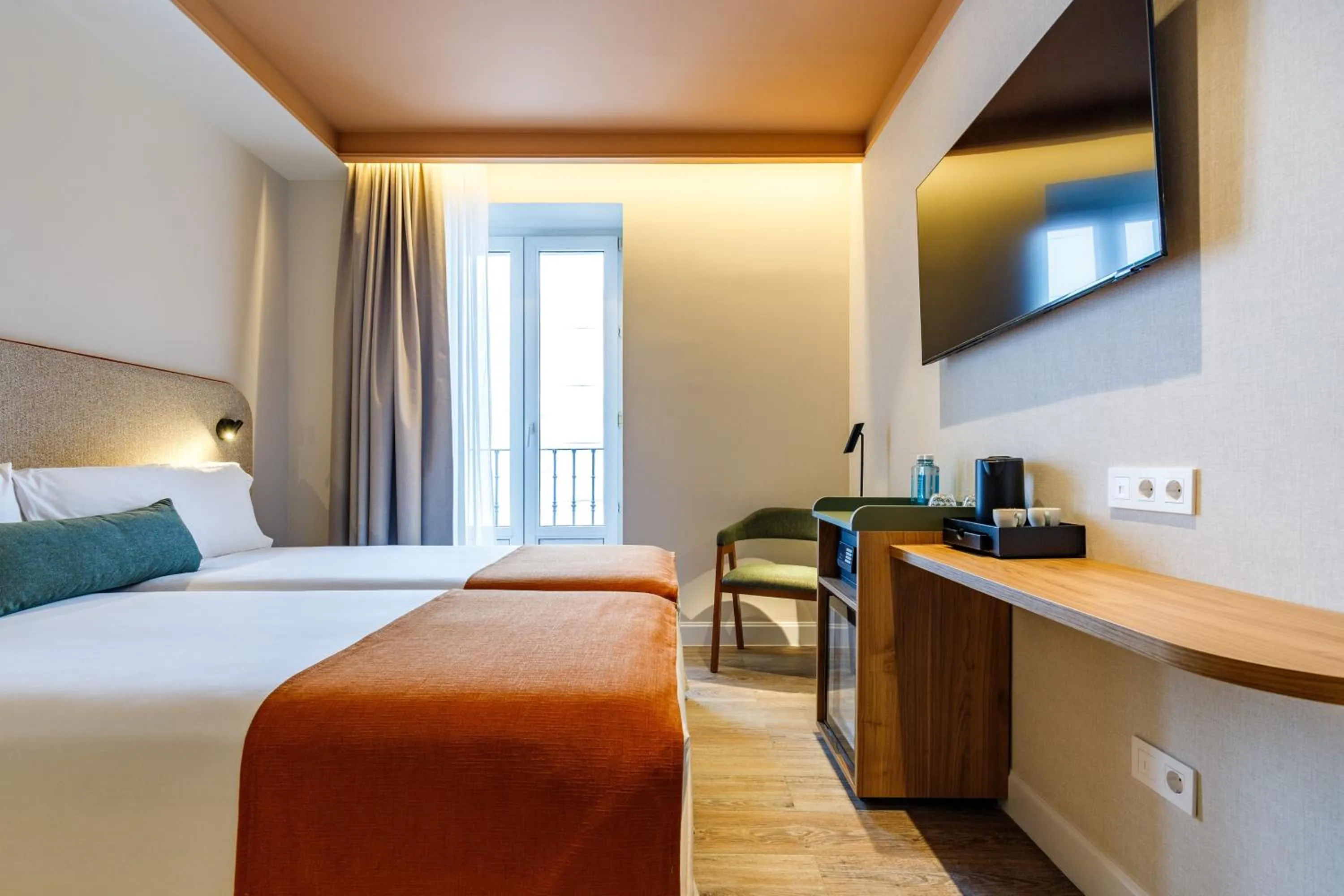 Bed in Petit Palace Puerta del Sol